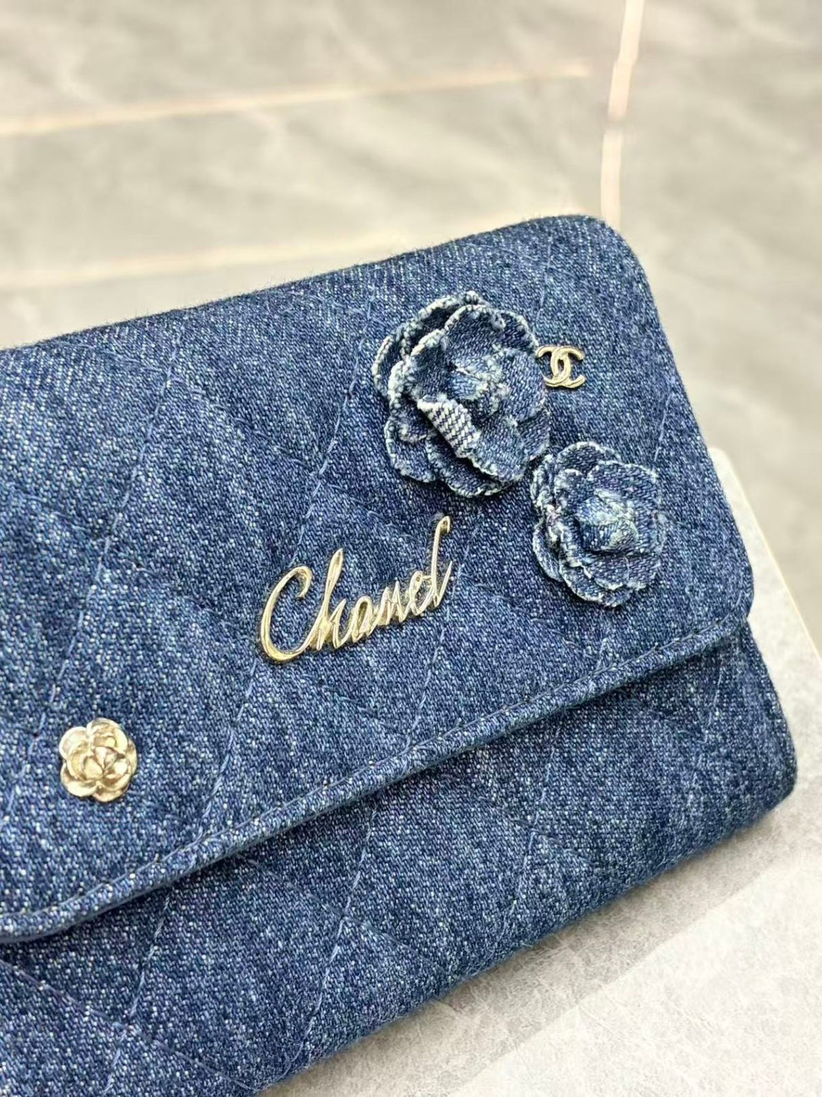 CHANEL Denim Wallet – Blue Quilted Denim with Camellia Appliqué and Gold-Tone CC, 27 Series, Good Pre-Owned