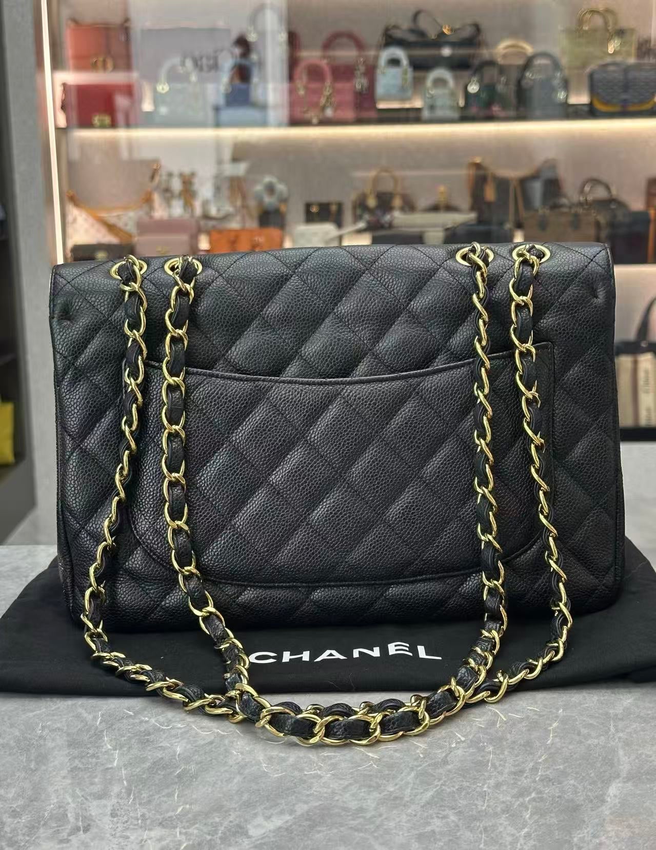 Chanel Classic Single Flap Jumbo Bag in black caviar leather with gold-tone hardware