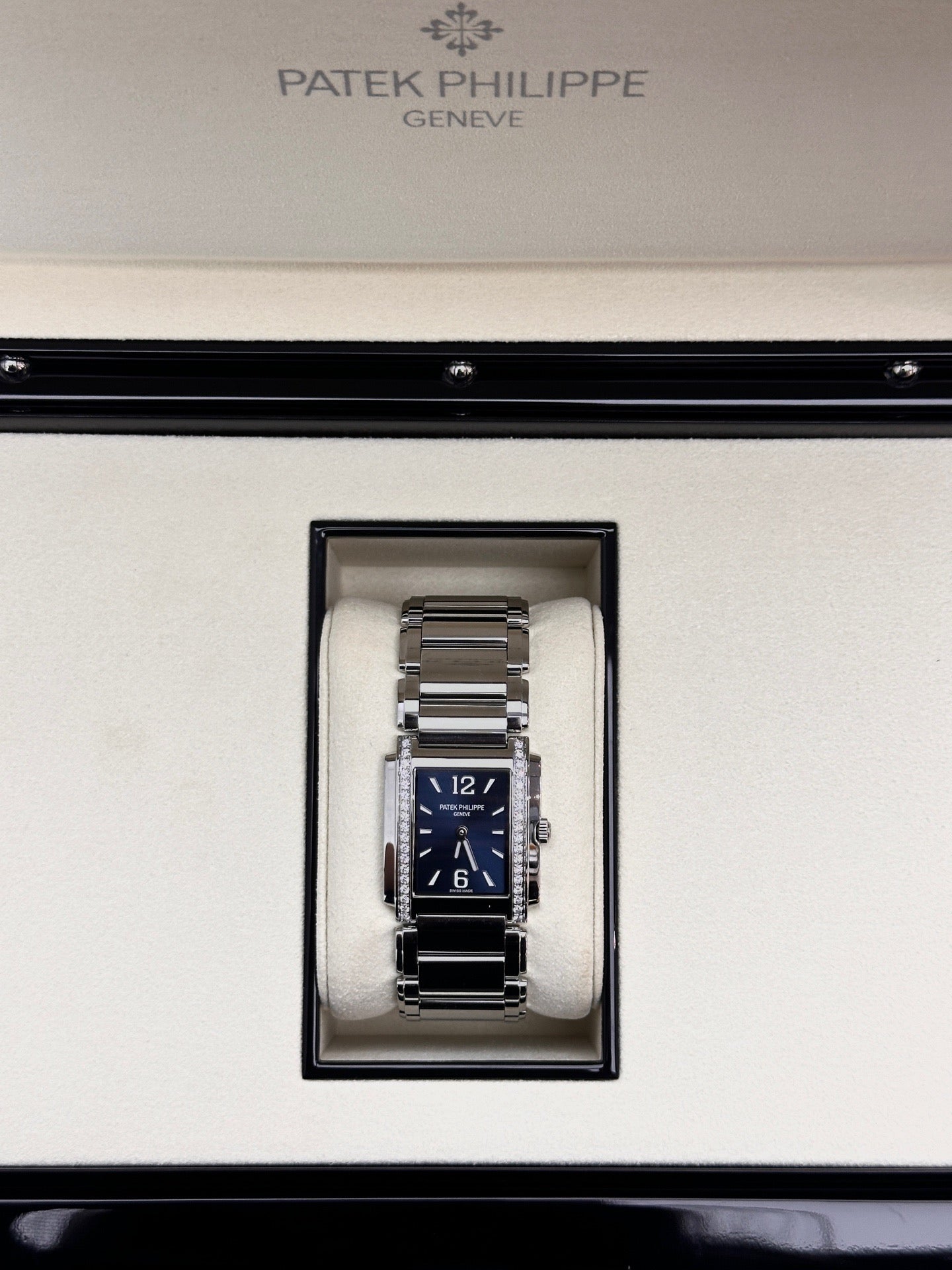 Patek Philippe Twenty~4 Ref. 4910/1200A-001 in stainless steel with a blue sunburst dial and diamond bezel