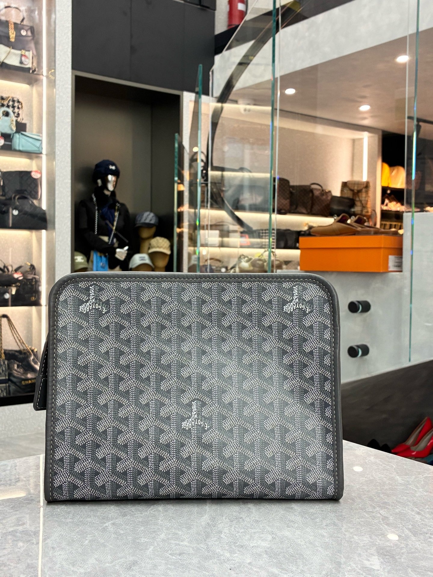 Goyard Jouvence gery toiletry pouch crafted from Goyardine canvas and chevron-patterned material