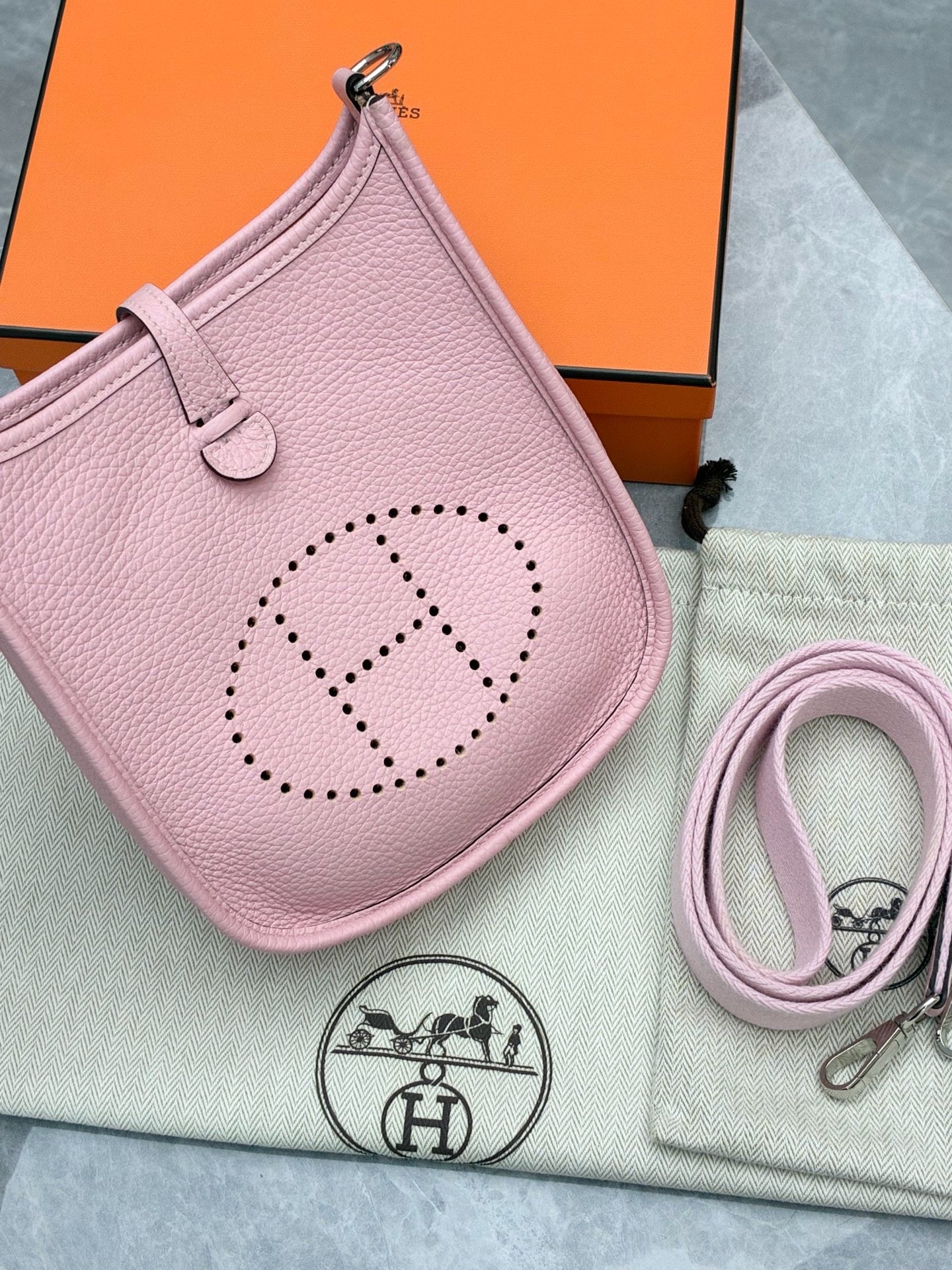 Hermès Mini Evelyne bag in Rose Sakura Clemence leather with silver-tone hardware
