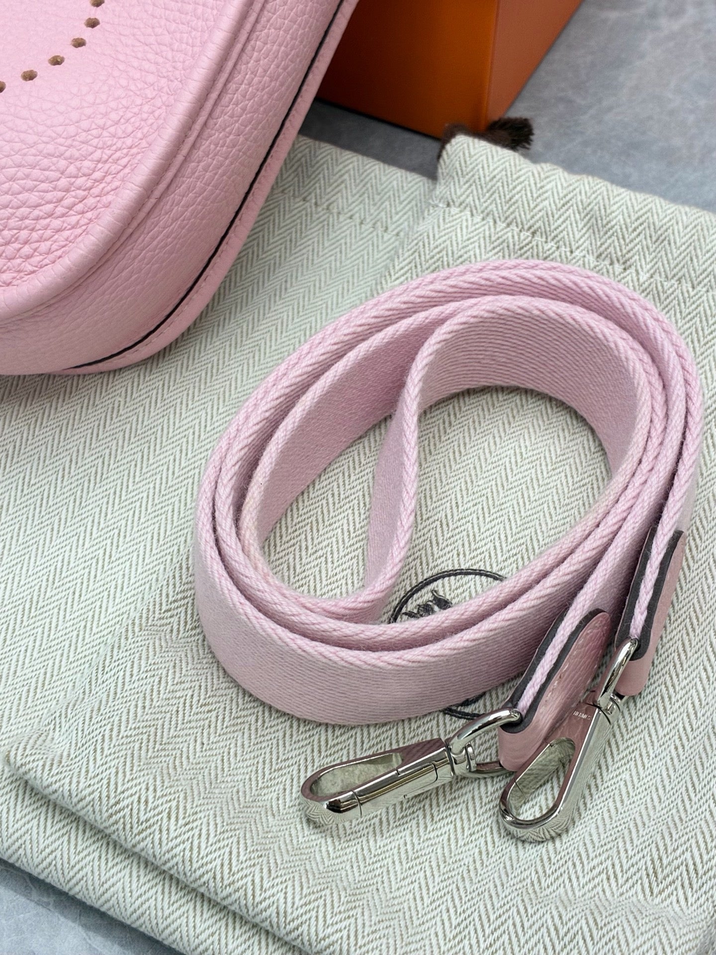 Hermès Mini Evelyne bag in Rose Sakura Clemence leather with silver-tone hardware
