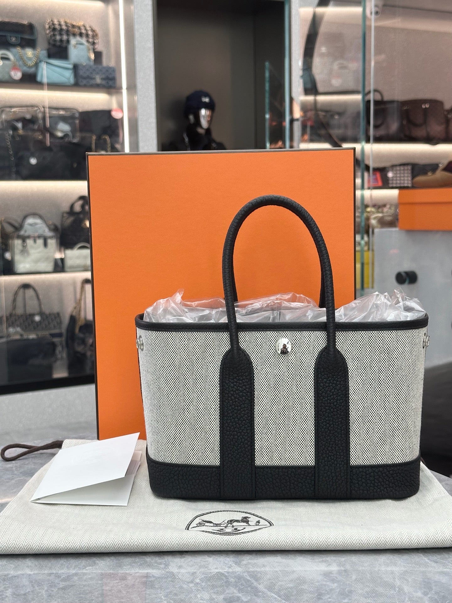 Hermès Neo Garden Party 23 handbag in Ecru and Noir Toile H Viking canvas with Negonda calfskin leathe