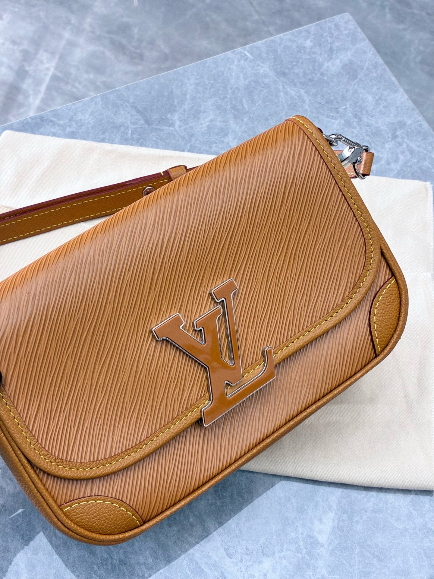 Louis Vuitton Buci crossbody bag crafted from honey-colored Epi leather