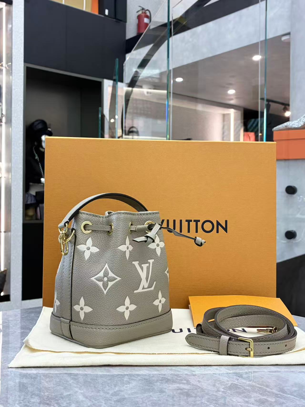Louis Vuitton Nano Noé bag is crafted from bicolour Monogram Empreinte leather