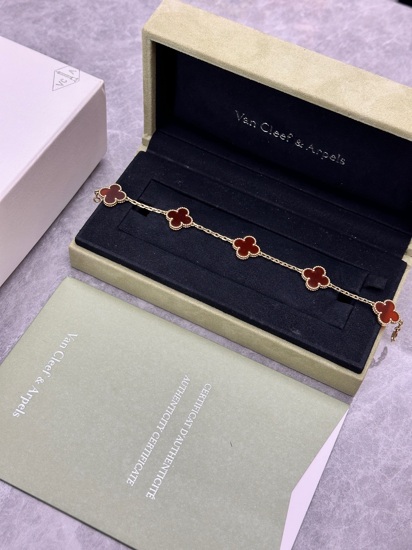 Van Cleef & Arpels Vintage Alhambra bracelet featuring carnelian stone motifs set in 18k yellow gold
