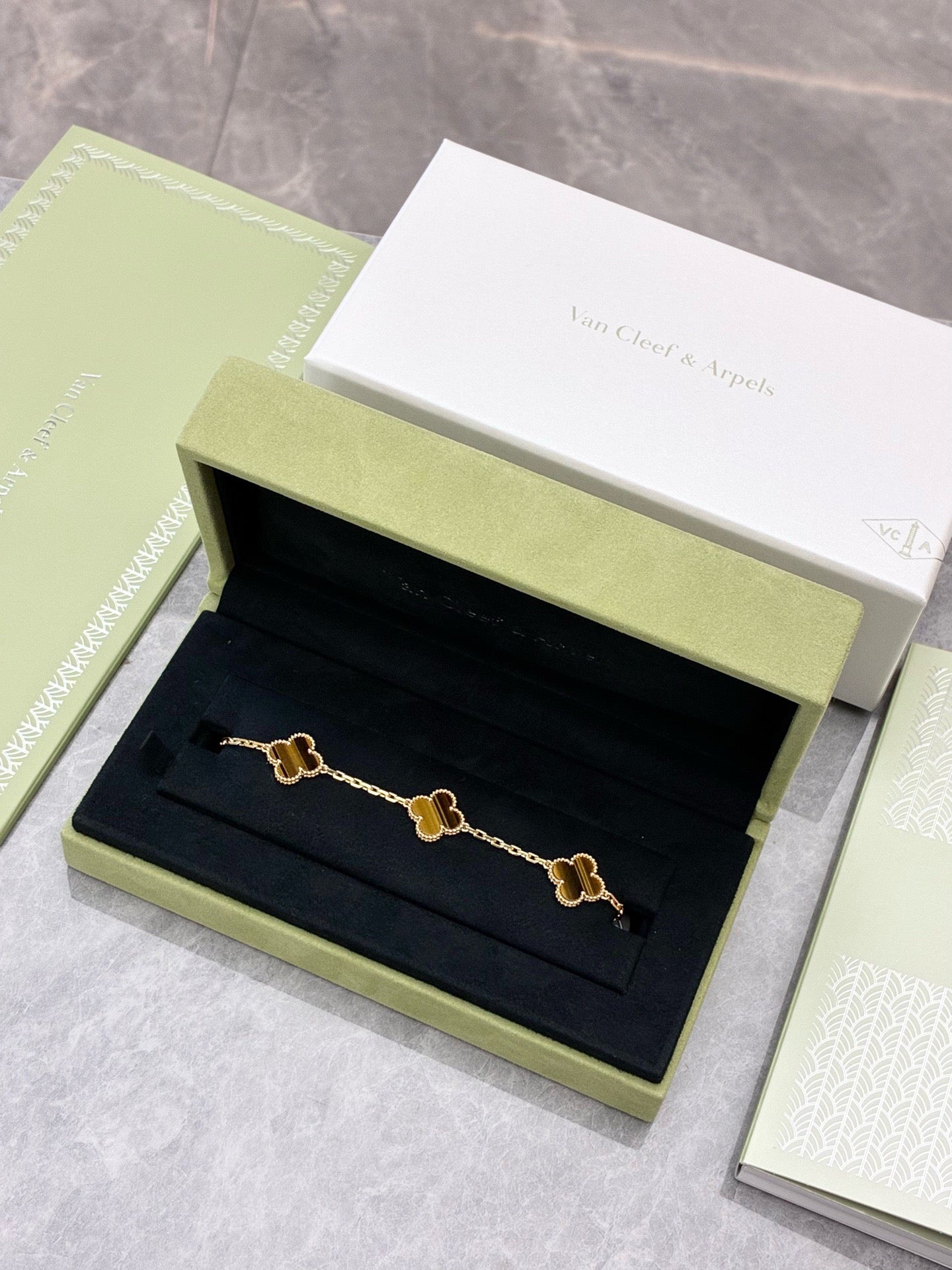 This Van Cleef & Arpels Vintage Alhambra bracelet features five motifs (tiger eye set in 18K yellow gold)
