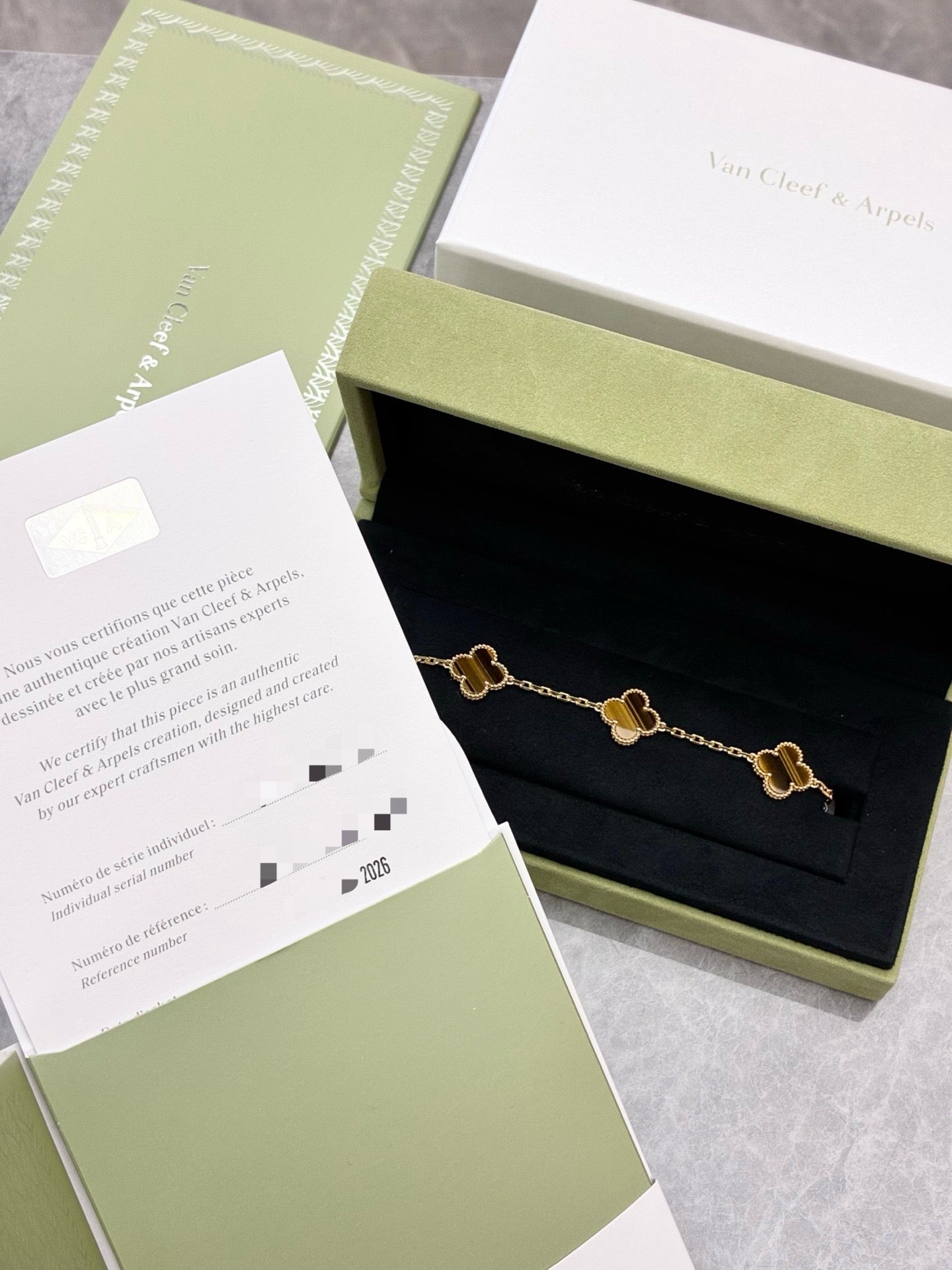 This Van Cleef & Arpels Vintage Alhambra bracelet features five motifs (tiger eye set in 18K yellow gold)