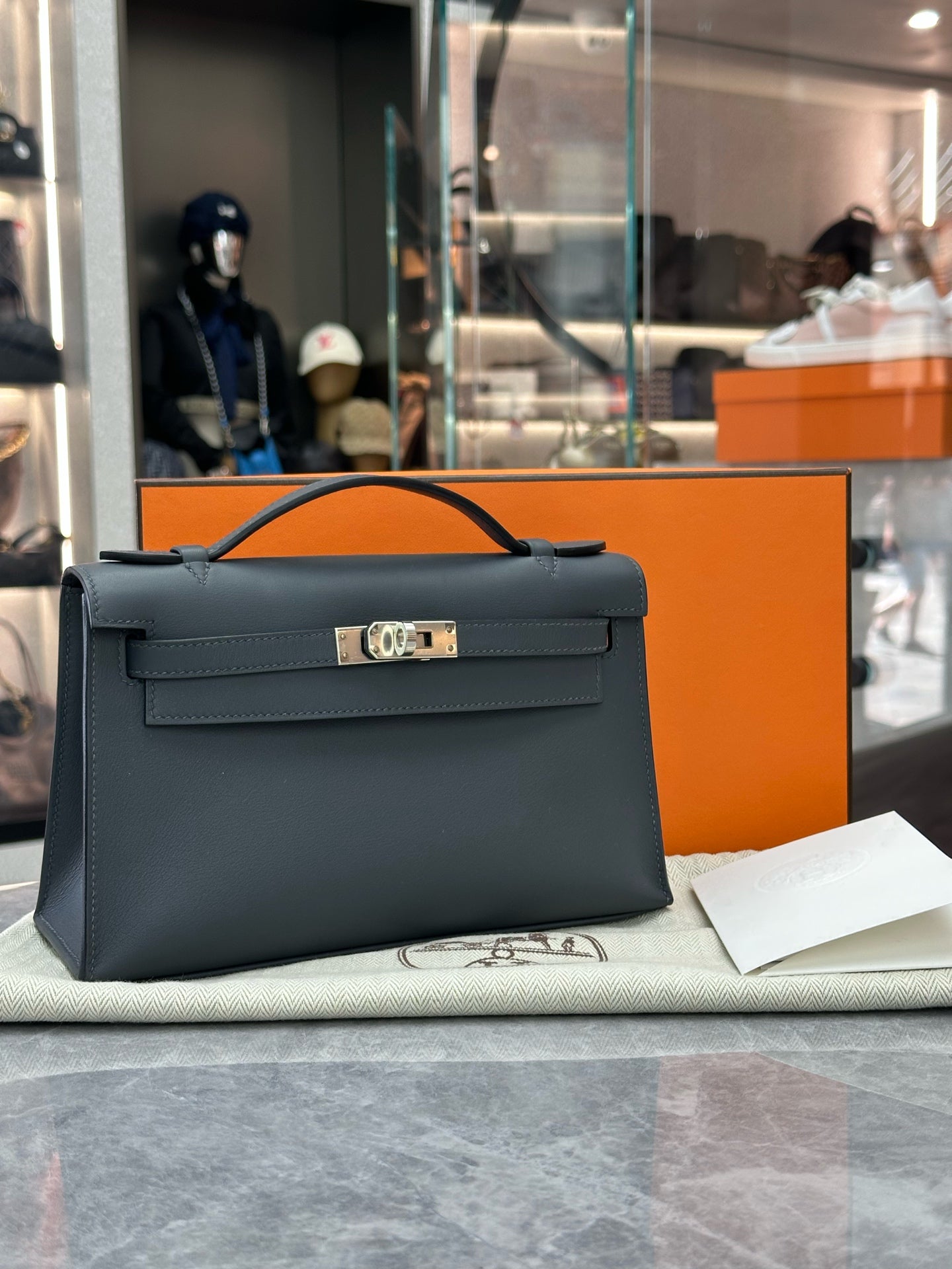 HERMÈS Mini Kelly I – Haze Grey Leather, Palladium Hardware, W Stamp, Excellent Pre-Owned