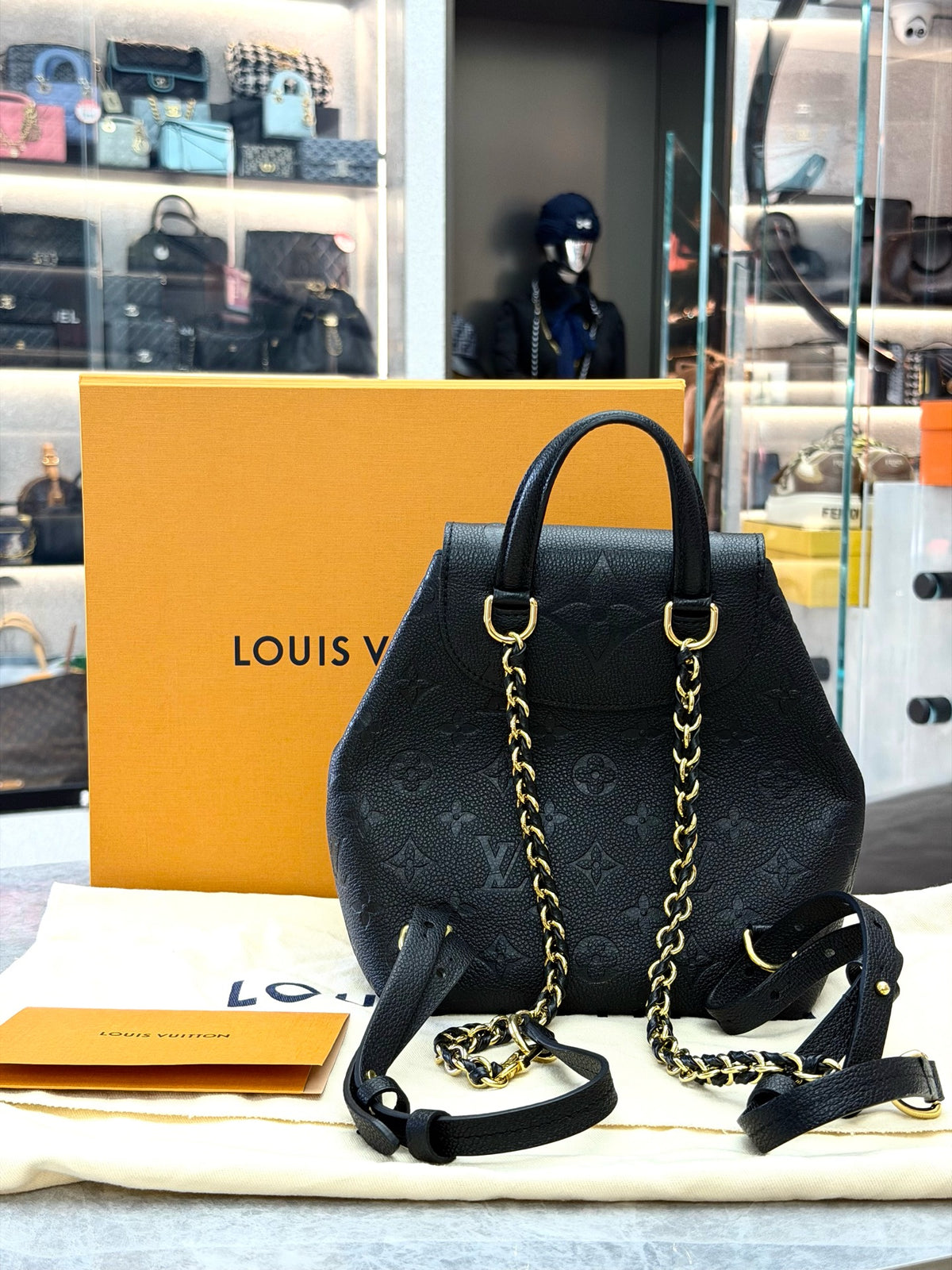 LOUIS VUITTON Monogram Canvas Backpack with Buckle Pockets – Black Grained Leather and Gold-Tone Hardware, 99% New