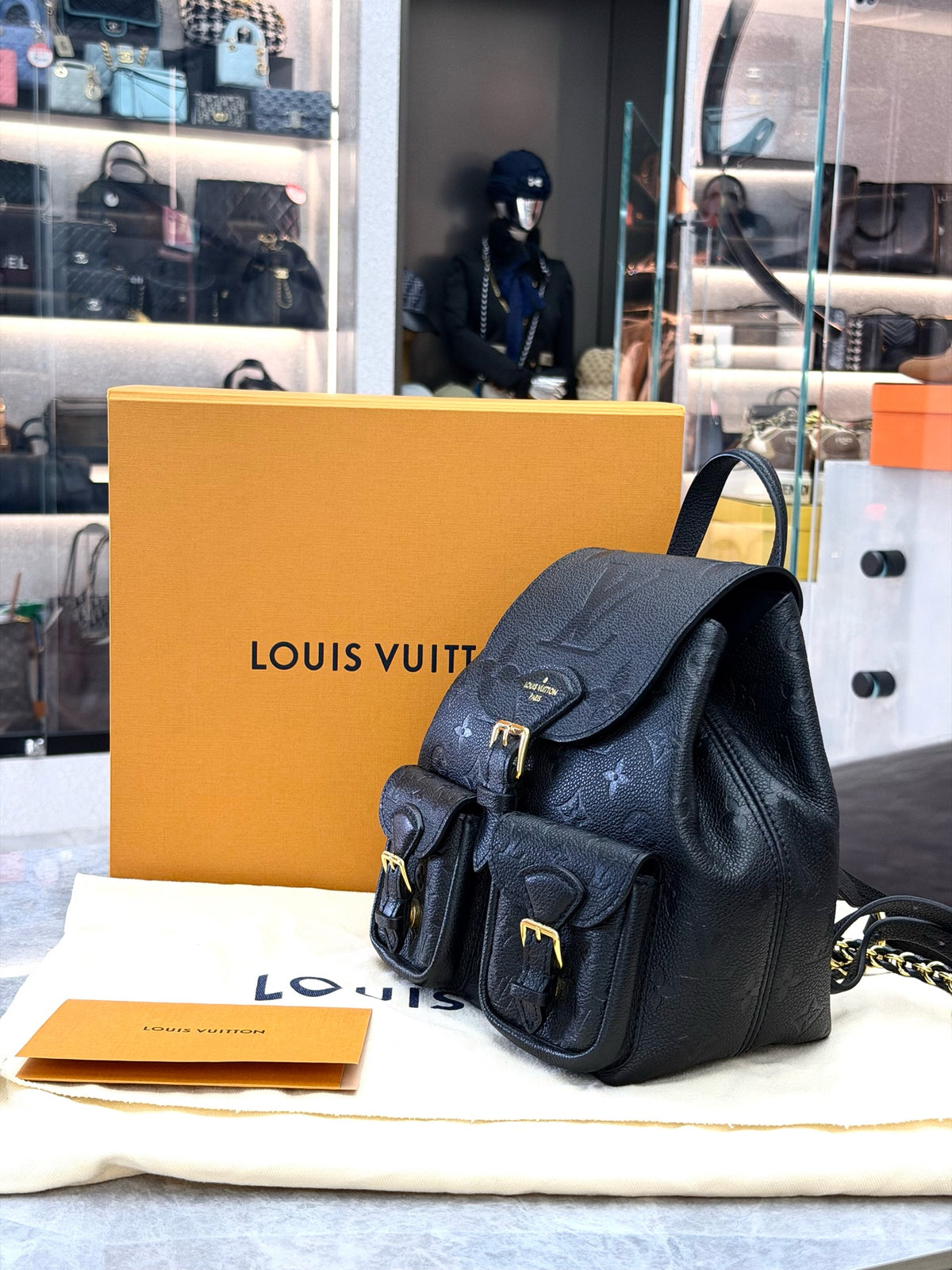 LOUIS VUITTON Monogram Canvas Backpack with Buckle Pockets – Black Grained Leather and Gold-Tone Hardware, 99% New