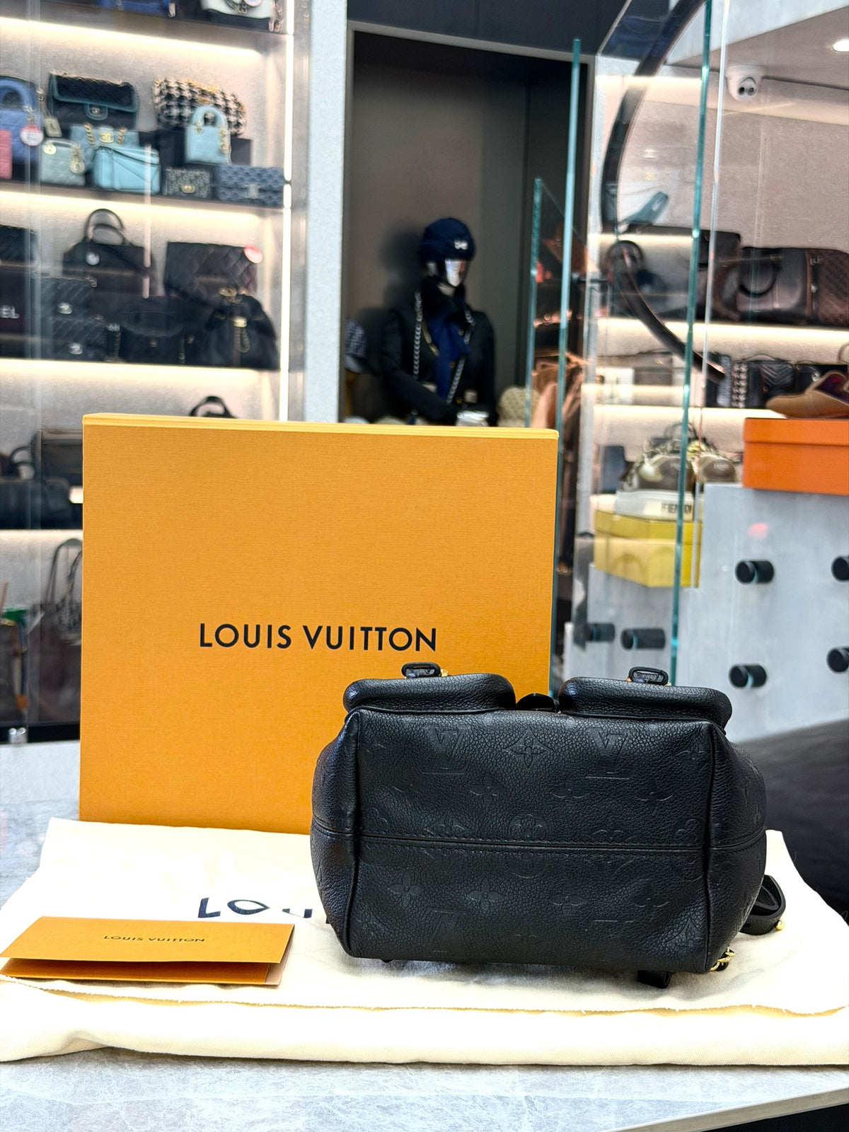 LOUIS VUITTON Monogram Canvas Backpack with Buckle Pockets – Black Grained Leather and Gold-Tone Hardware, 99% New