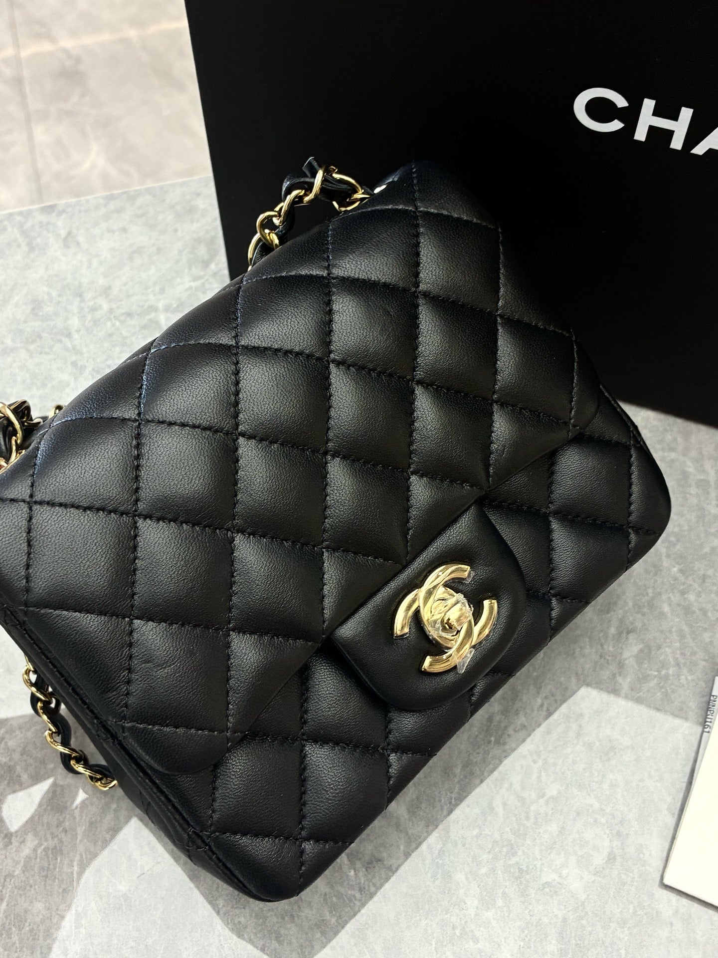CHANEL Classic Flap Mini Square – Black Lambskin, Champagne Gold Hardware, Reference A69900, Excellent Pre-Owned