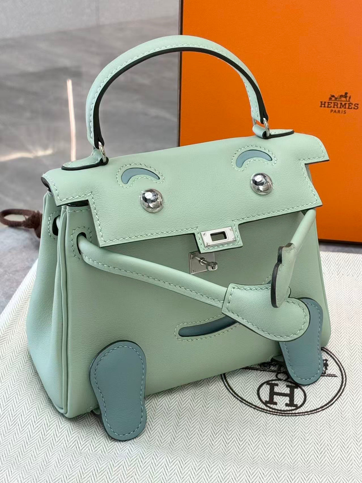 HERMÈS Kelly Doll – 6U Mint Swift Leather, Lake Blue Feet, Palladium Hardware, G Stamp, Brand New