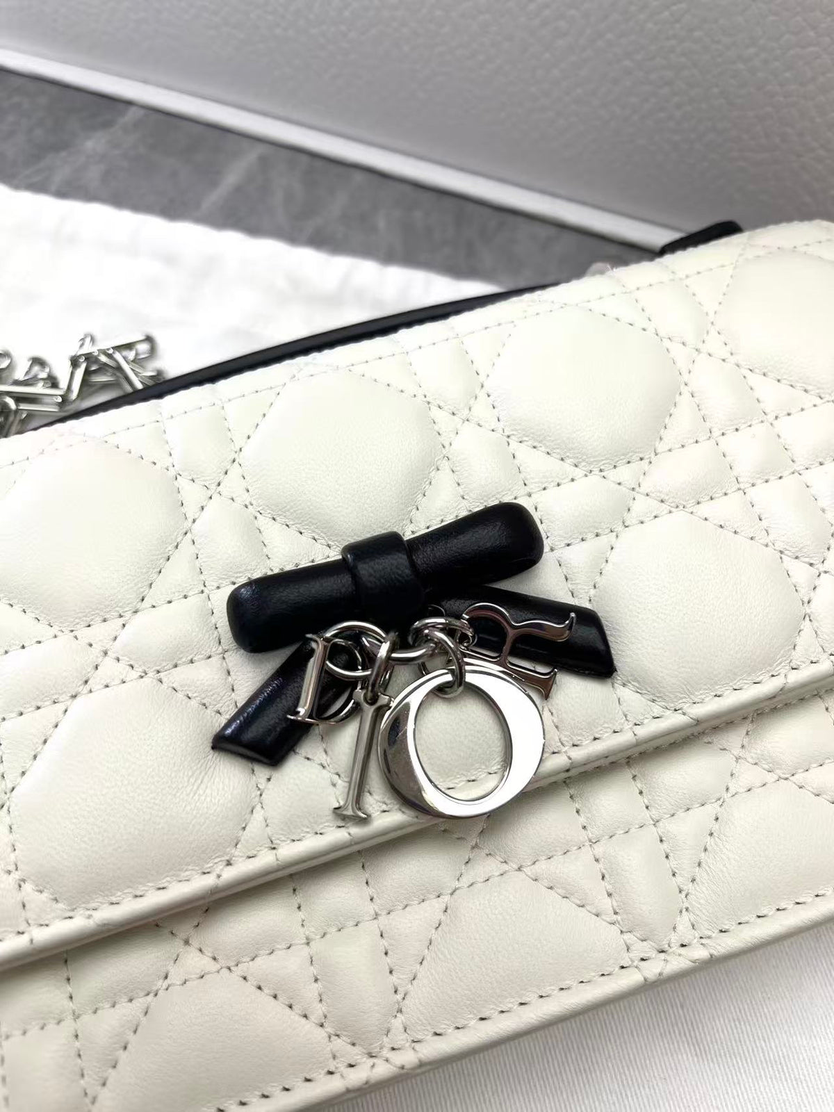 CHRISTIAN DIOR Lady Dior East-West – Ivory Cannage Lambskin with Black Bow, Silver Hardware, Excellent Pre-Owned