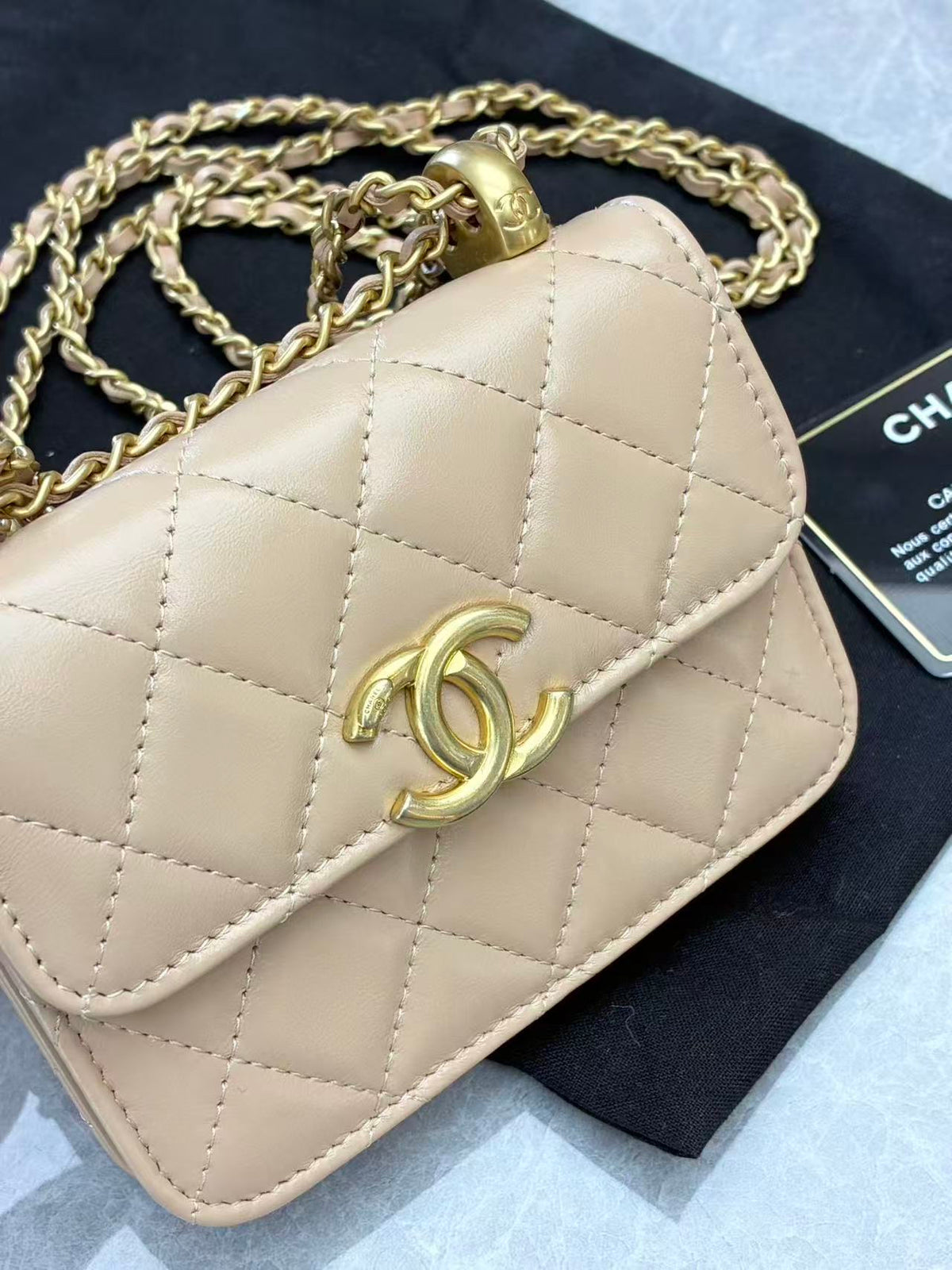 CHANEL 21A Wallet on Chain – Milk Tea Beige Quilted Lambskin with Gold Hardware and Double Gold Balls, 12.5 cm, 31 Series, Excellent Pre-Owned