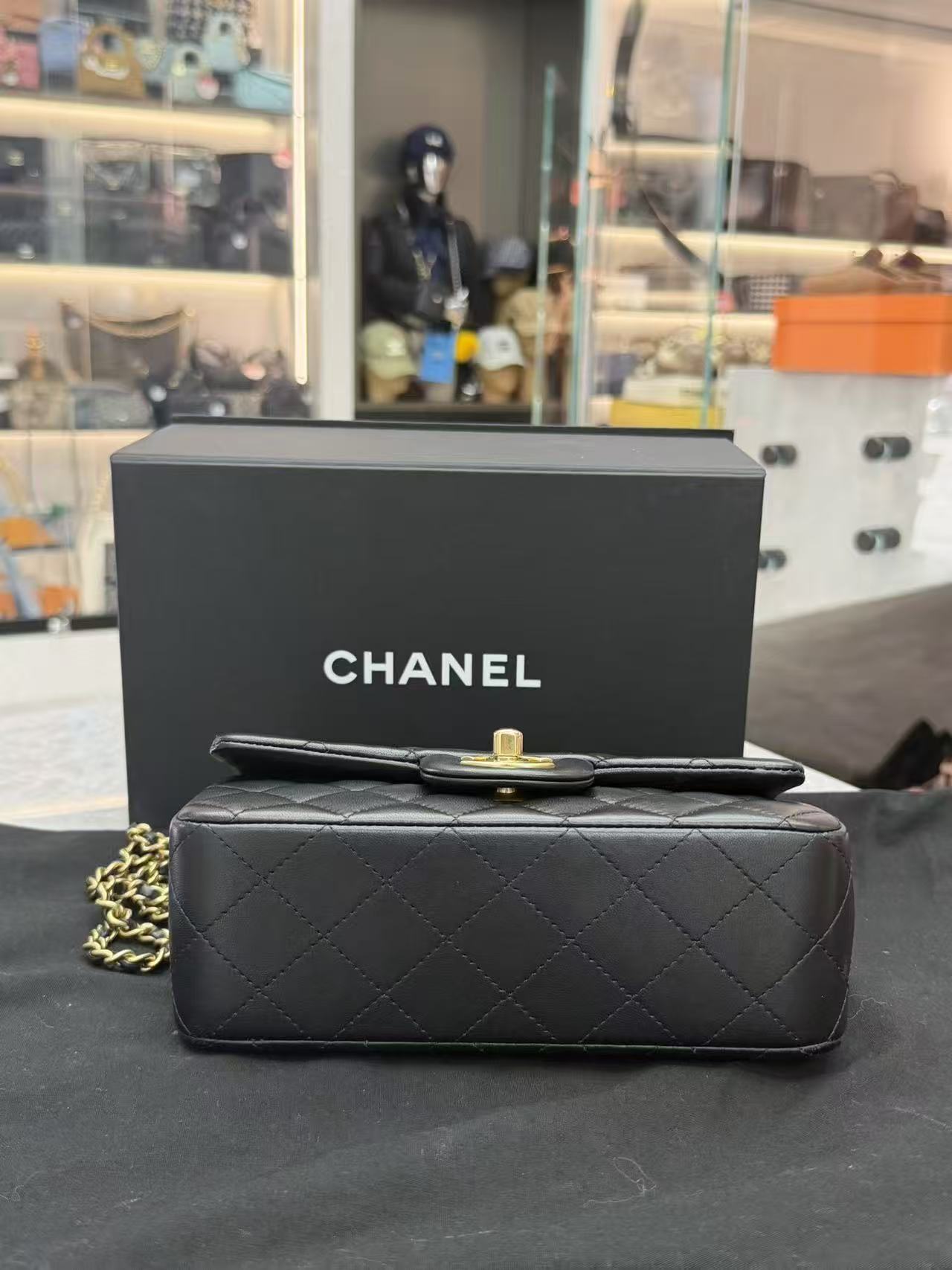 Chanel Top Handle Mini Rectangular Flap Bag in black lambskin leather with antique gold hardware