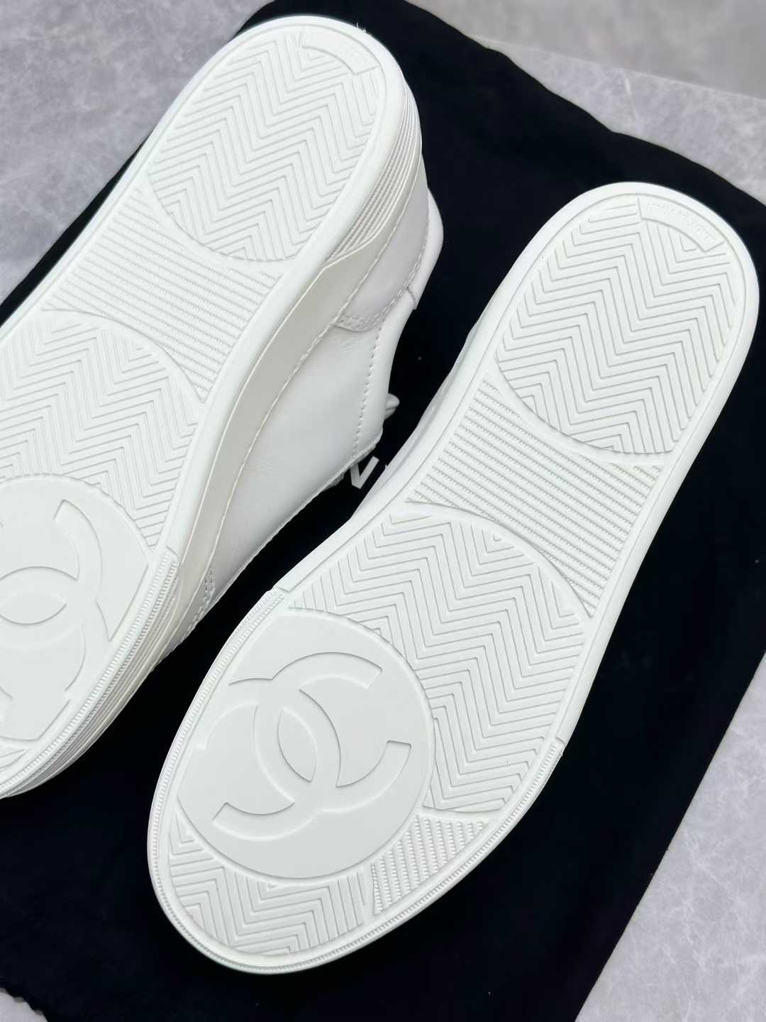 Chanel white calfskin sneakers, identified as style G45085 from the 23S collection, size 37
