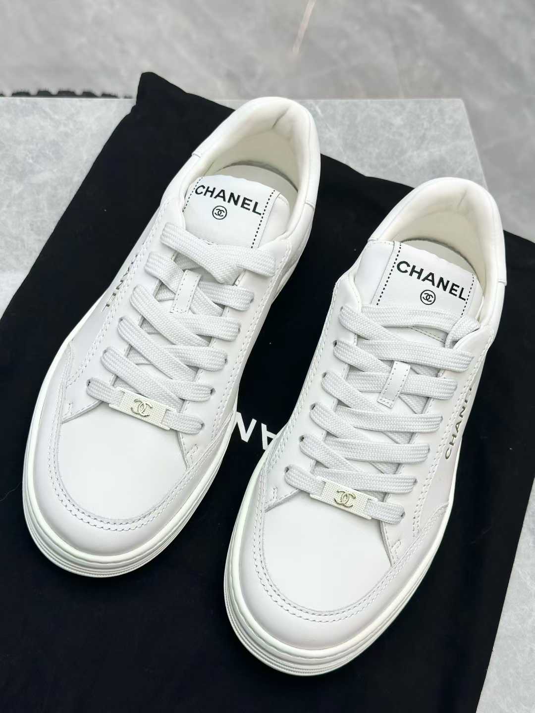 Chanel white calfskin sneakers, identified as style G45085 from the 23S collection, size 37