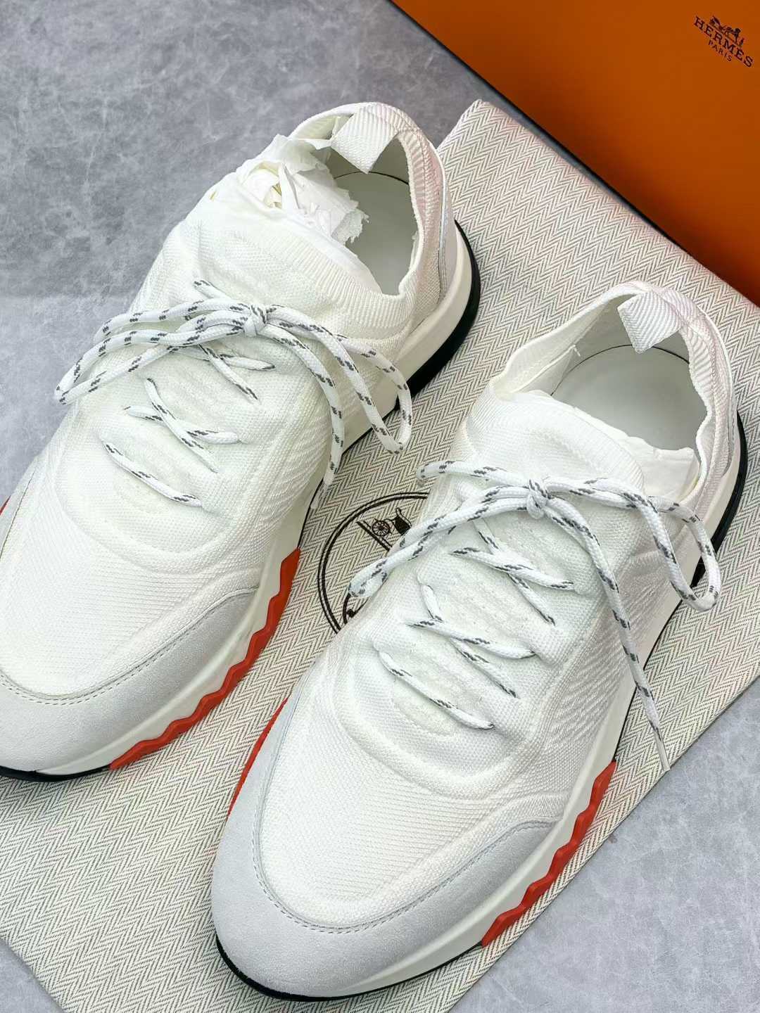 Hermès Addict sneakers in white canvas and leather with a black and orange sole, size 36