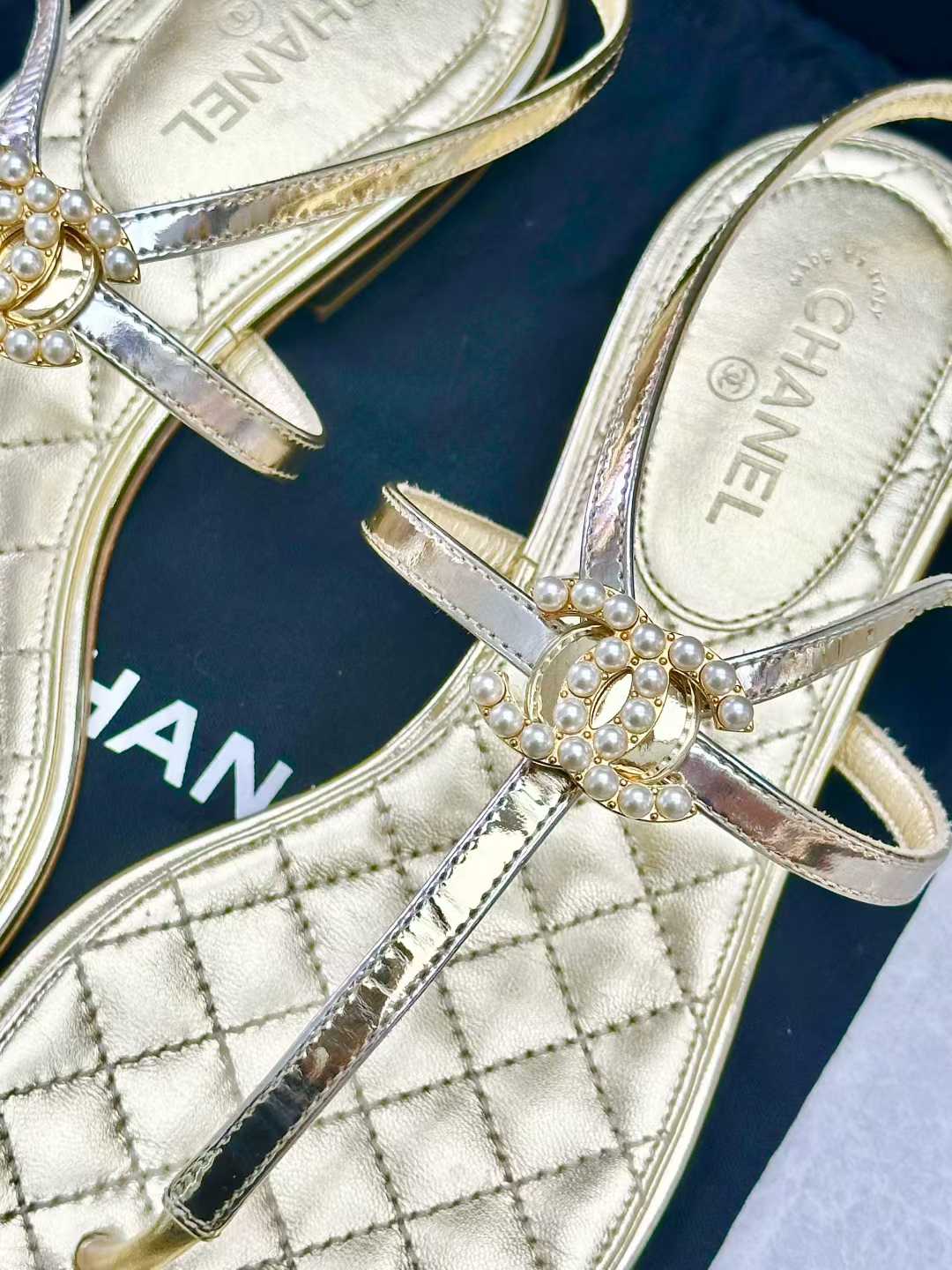 Chanel gold leather thong sandals, featuring a quilted insole and a CC logo with pearl details on the T-strap, size36C