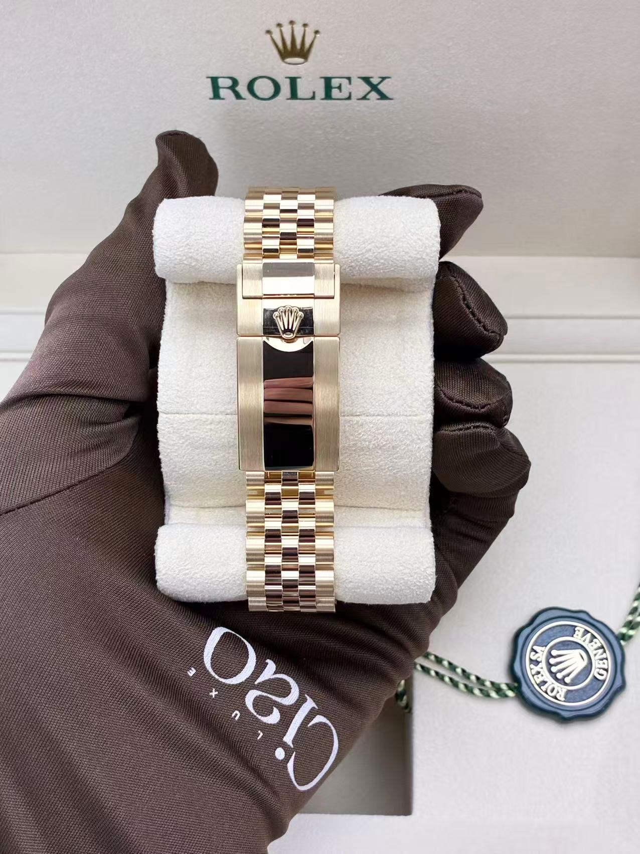 Rolex GMT-Master II, 18k yellow gold with a black dial and a grey and black Cerachrom bezel on a Jubilee bracelet