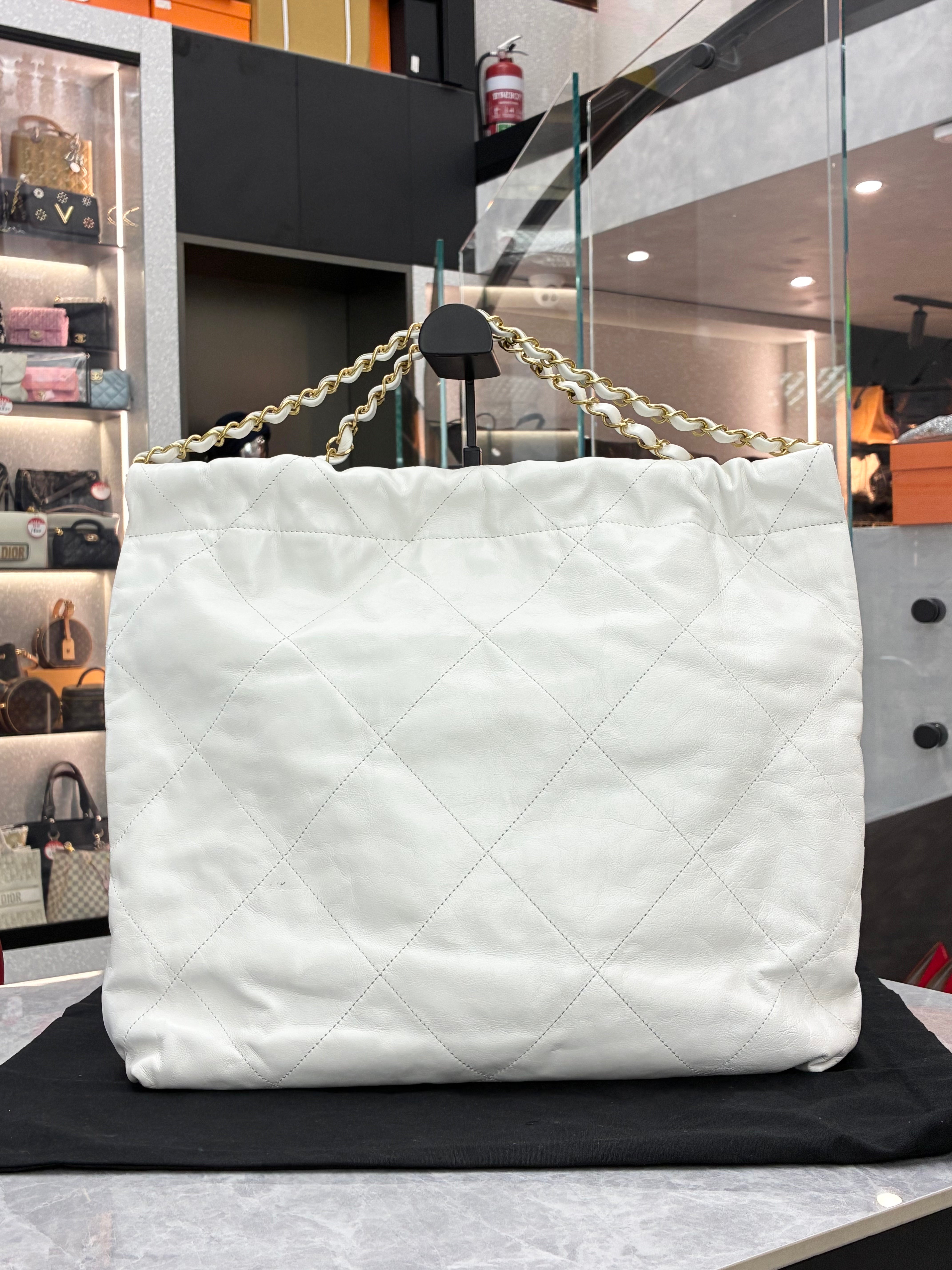 Chanel 22 Hobo bag in a small size, made of white calfskin leather with gold-tone hardware