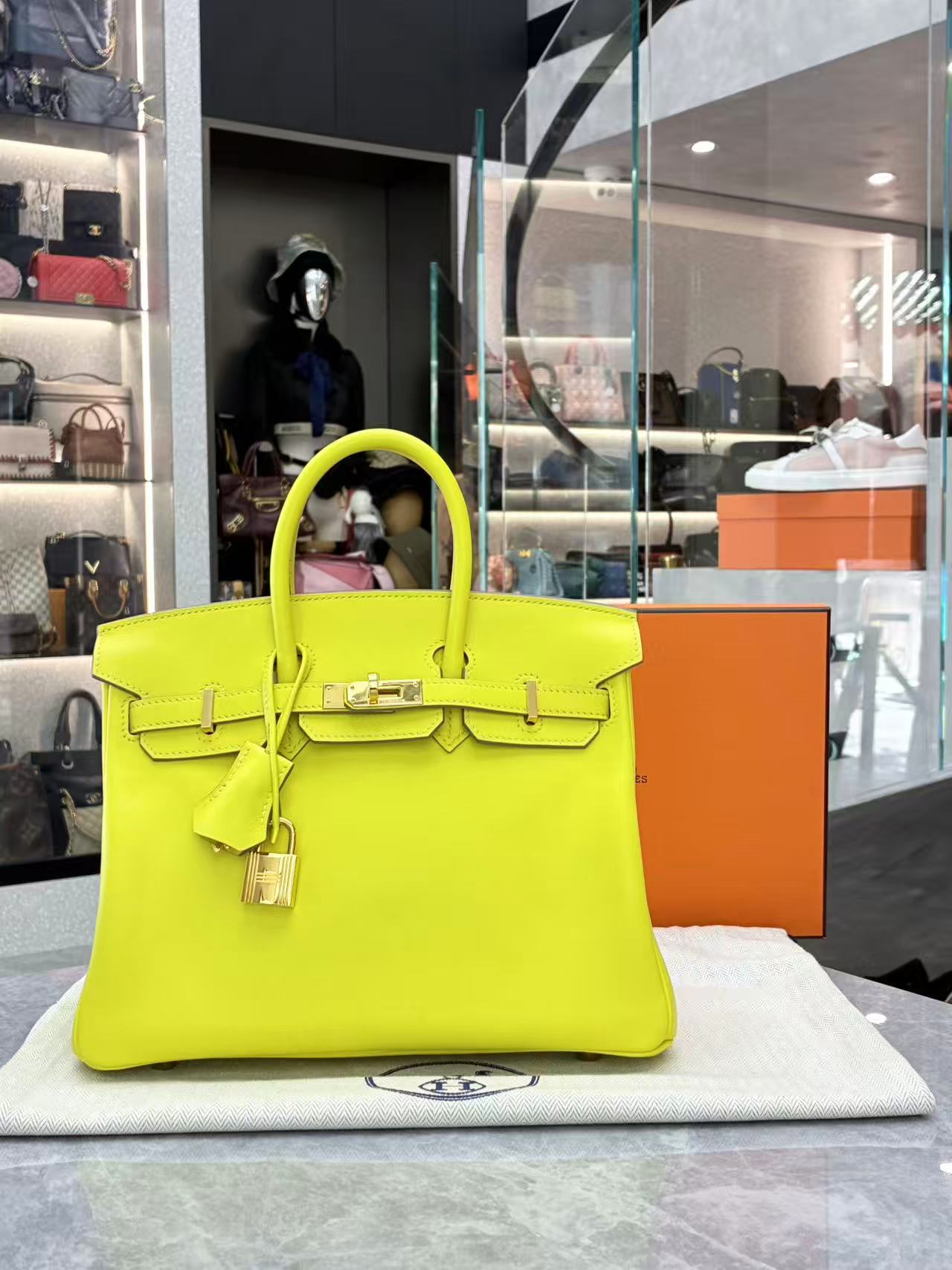 Hermès Birkin bag in the vibrant "Lime" color and Epsom leather with gold hardware