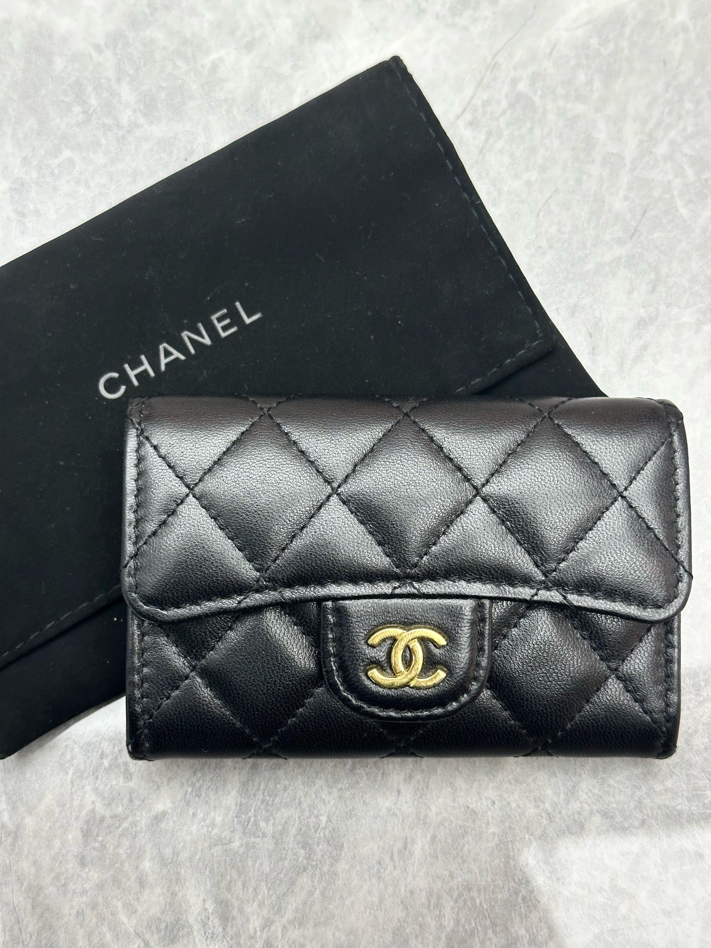 Chanel Classic Card Holder in black quilted lambskin leather with gold tone hardware