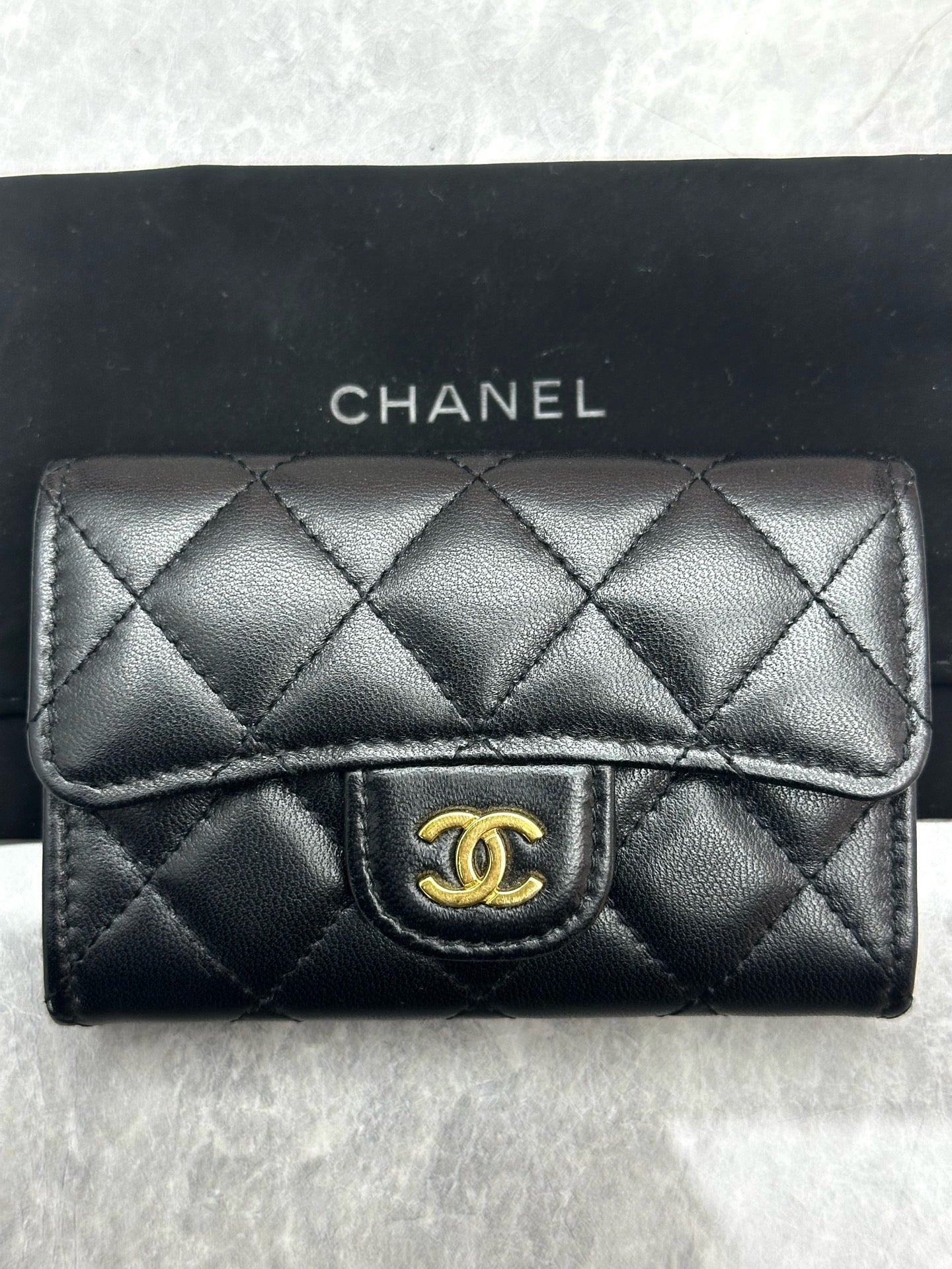 Chanel Classic Card Holder in black quilted lambskin leather with gold tone hardware