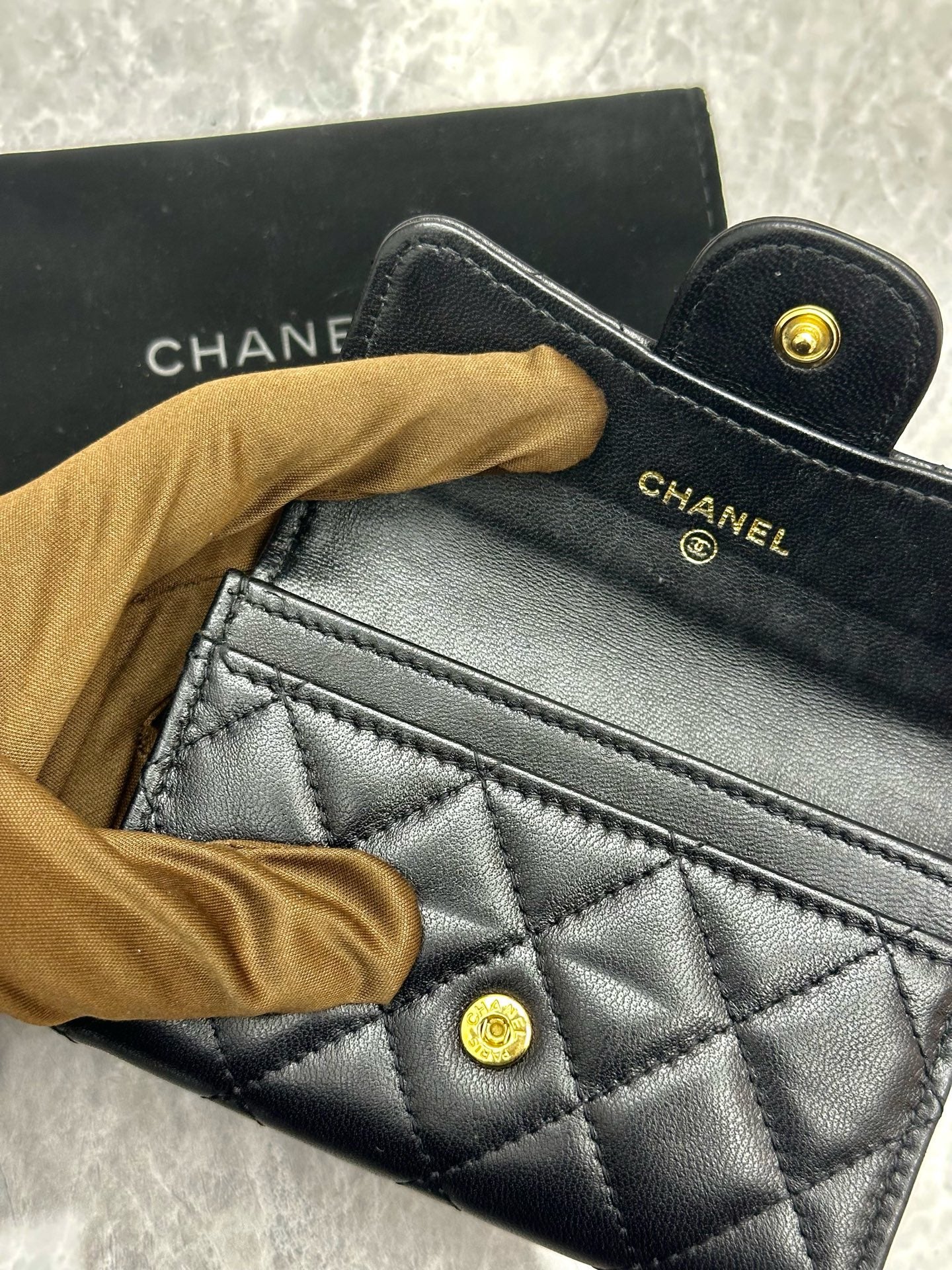 Chanel Classic Card Holder in black quilted lambskin leather with gold tone hardware