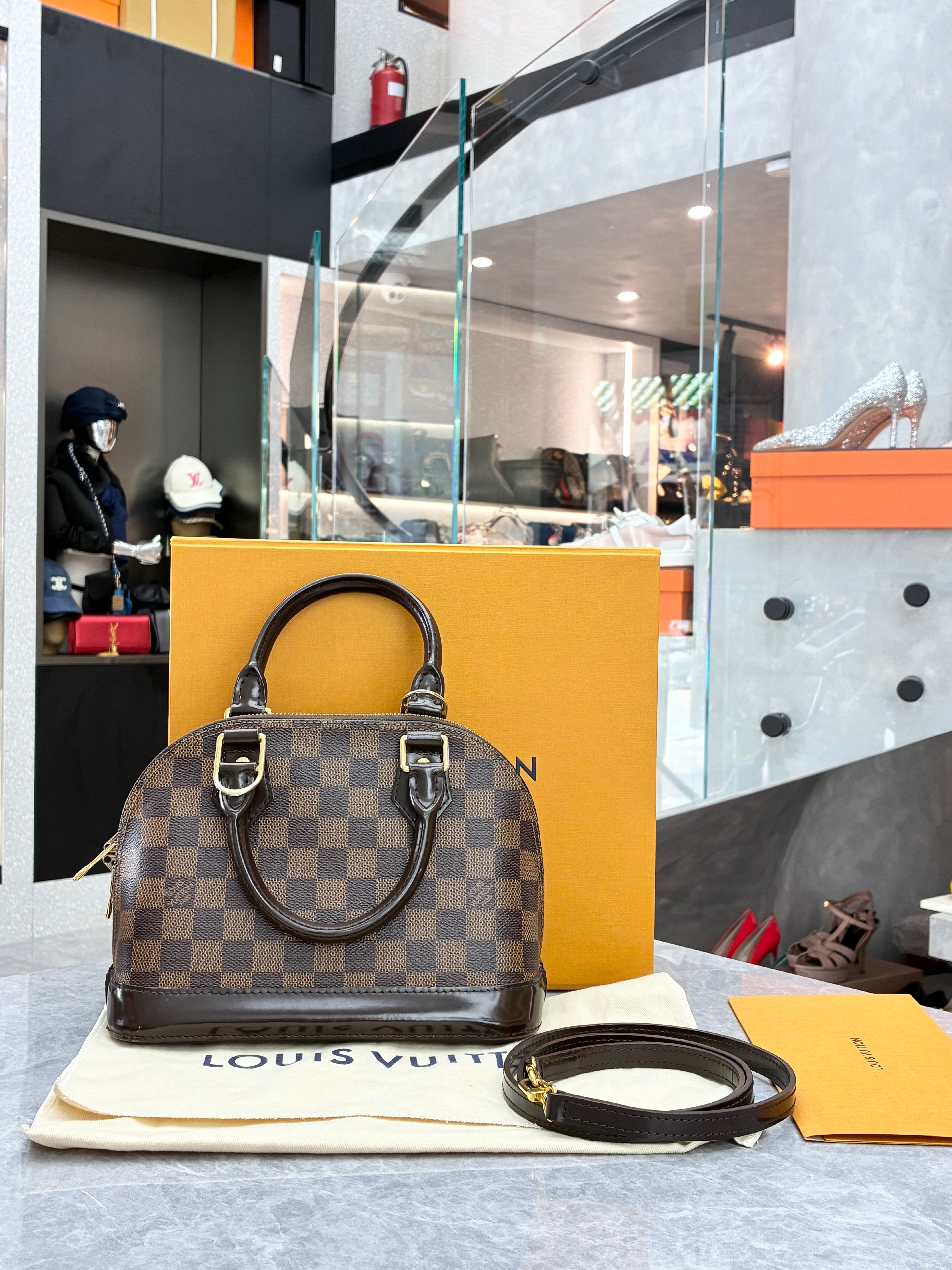 Louis Vuitton Alma BB bag in Damier Ebene canvas