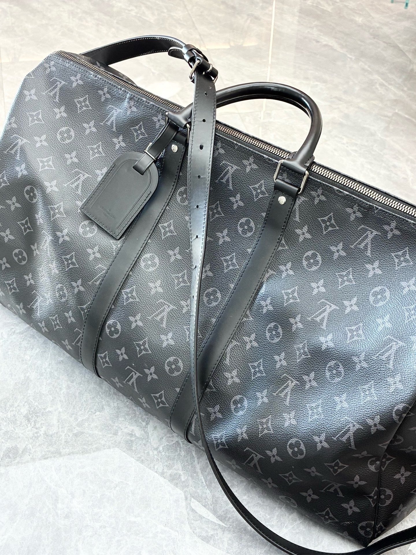 LOUIS VUITTON Keepall 55 – Monogram Eclipse Canvas, Black Cowhide, Matte Black Hardware, 55 cm, Excellent Pre-Owned
