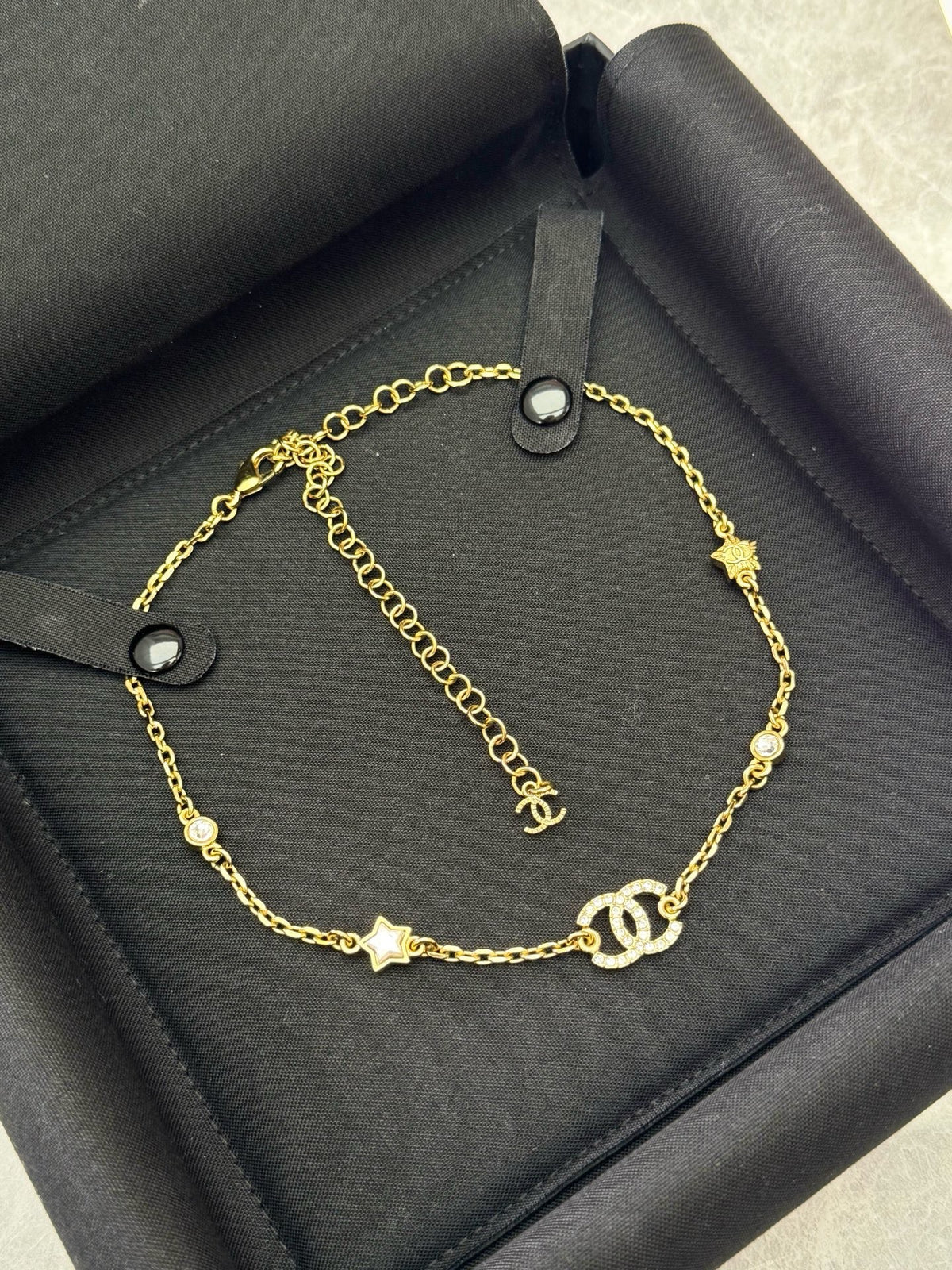 CHANEL 24C Necklace – Gold-Tone Chain with Crystal CC and Star Charms, Brand New