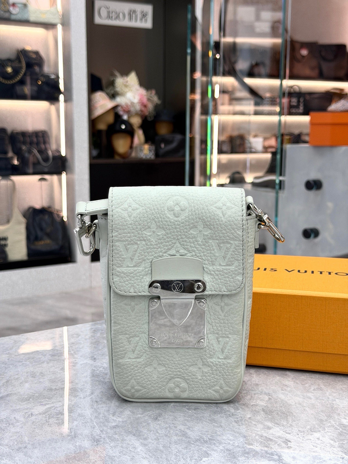 LOUIS VUITTON S-Lock Vertical – Pale Grey-Green Embossed Monogram Calfskin, Silver Hardware, Excellent Pre-Owned