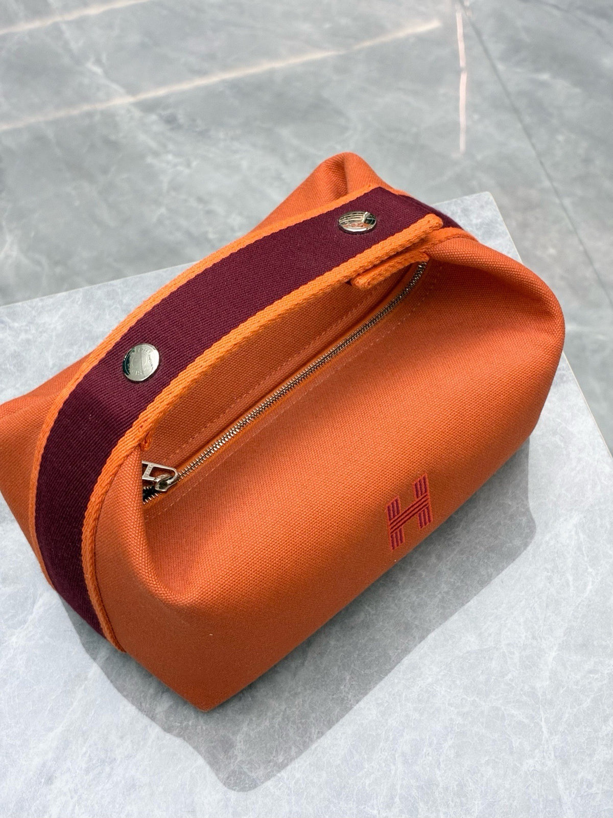 HERMÈS Bride-a-Brac PM – Flame Orange Canvas with Burgundy Webbing and Embroidered H, Good Pre-Owned