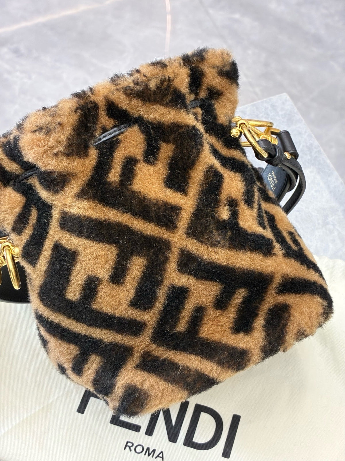 FENDI Mon Tresor Mini Bucket Bag – Shearling with Large FF Motif, Gold Hardware, Good Pre-Owned