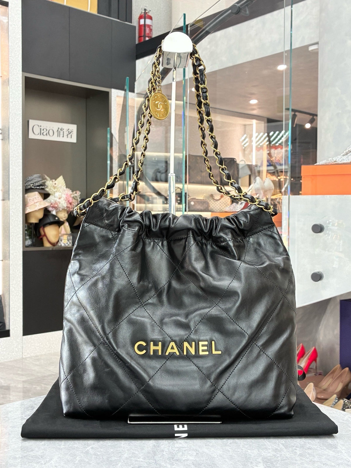 CHANEL 22 Small Hobo – Black Shiny Calfskin with Gold Hardware and Gilded CHANEL Letters, Excellent Pre-Owned
