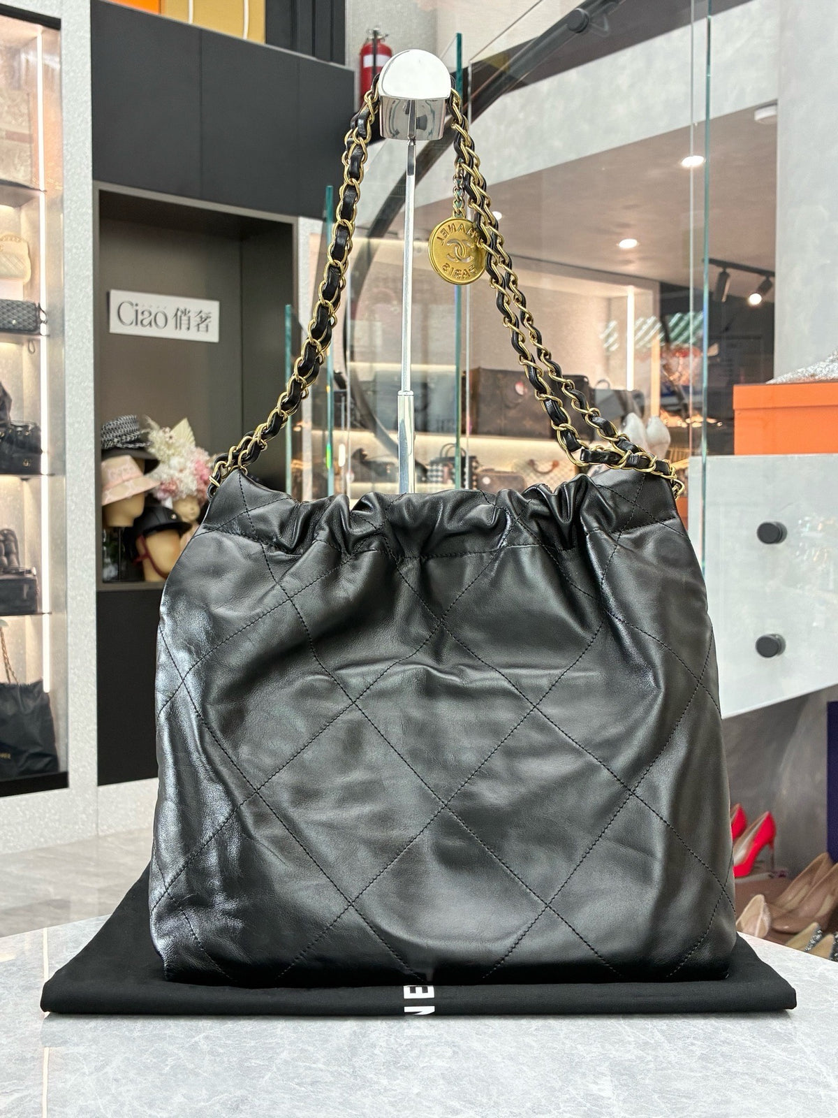 CHANEL 22 Small Hobo – Black Shiny Calfskin with Gold Hardware and Gilded CHANEL Letters, Excellent Pre-Owned
