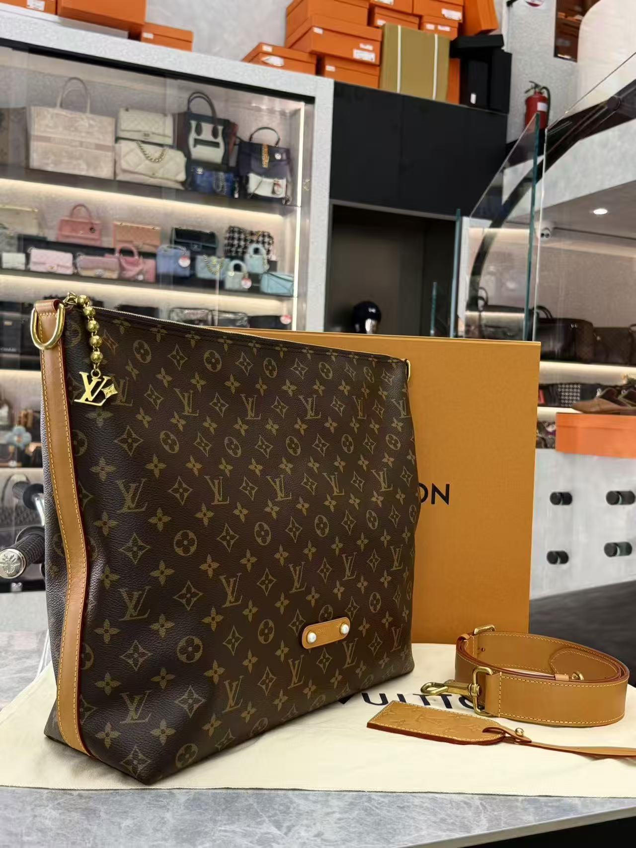 Louis Vuitton Vagabond Hobo bag in monogram coated canvas with vachetta leather trim and gold-toned hardware