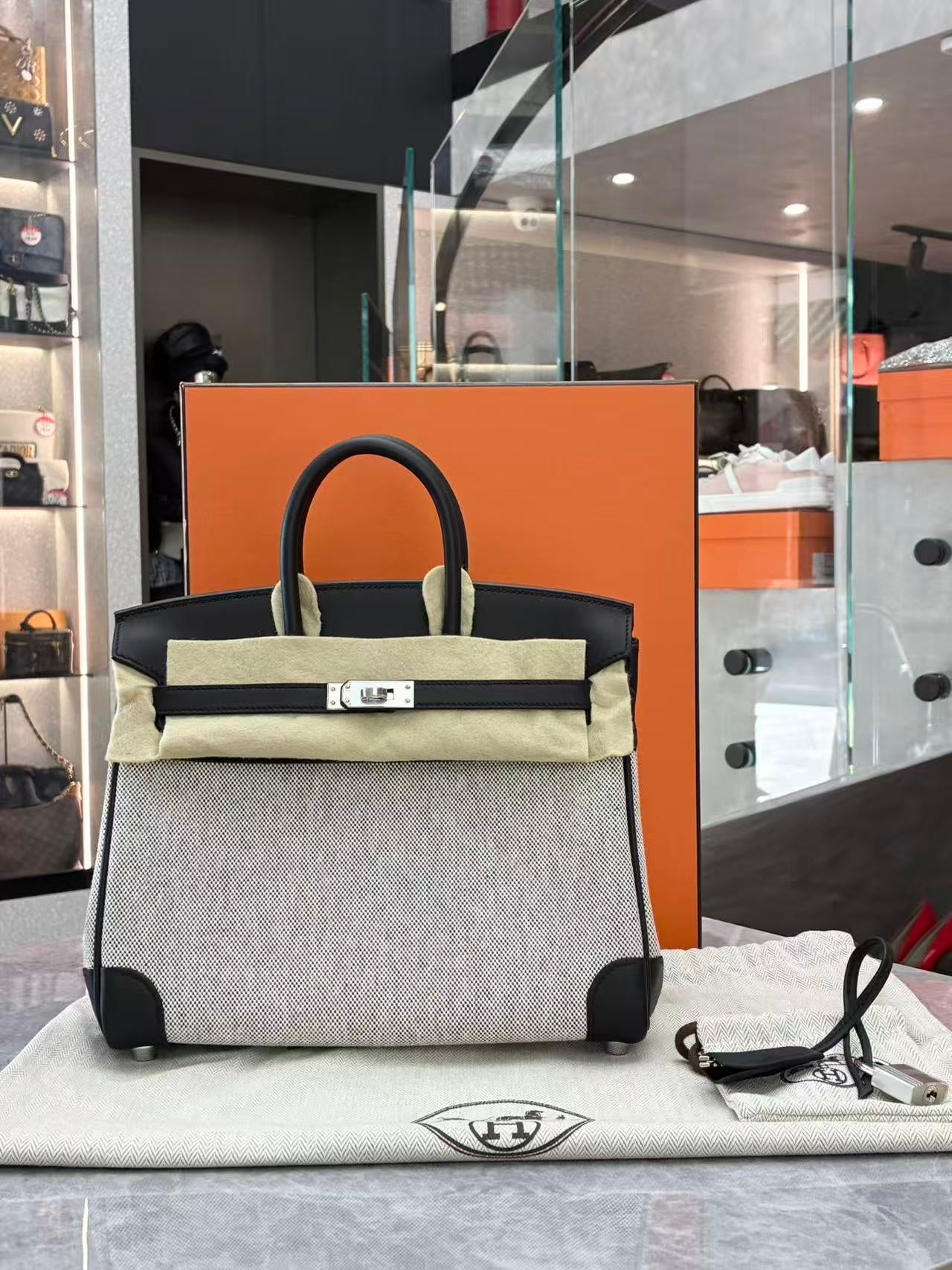 HERMÈS Birkin 25 Panda black leather and Toile canvas front view
