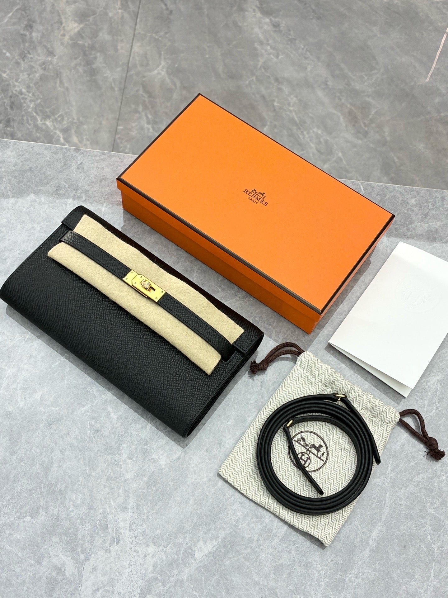 Hermès Kelly To Go wallet in black Epsom leather with gold hardware