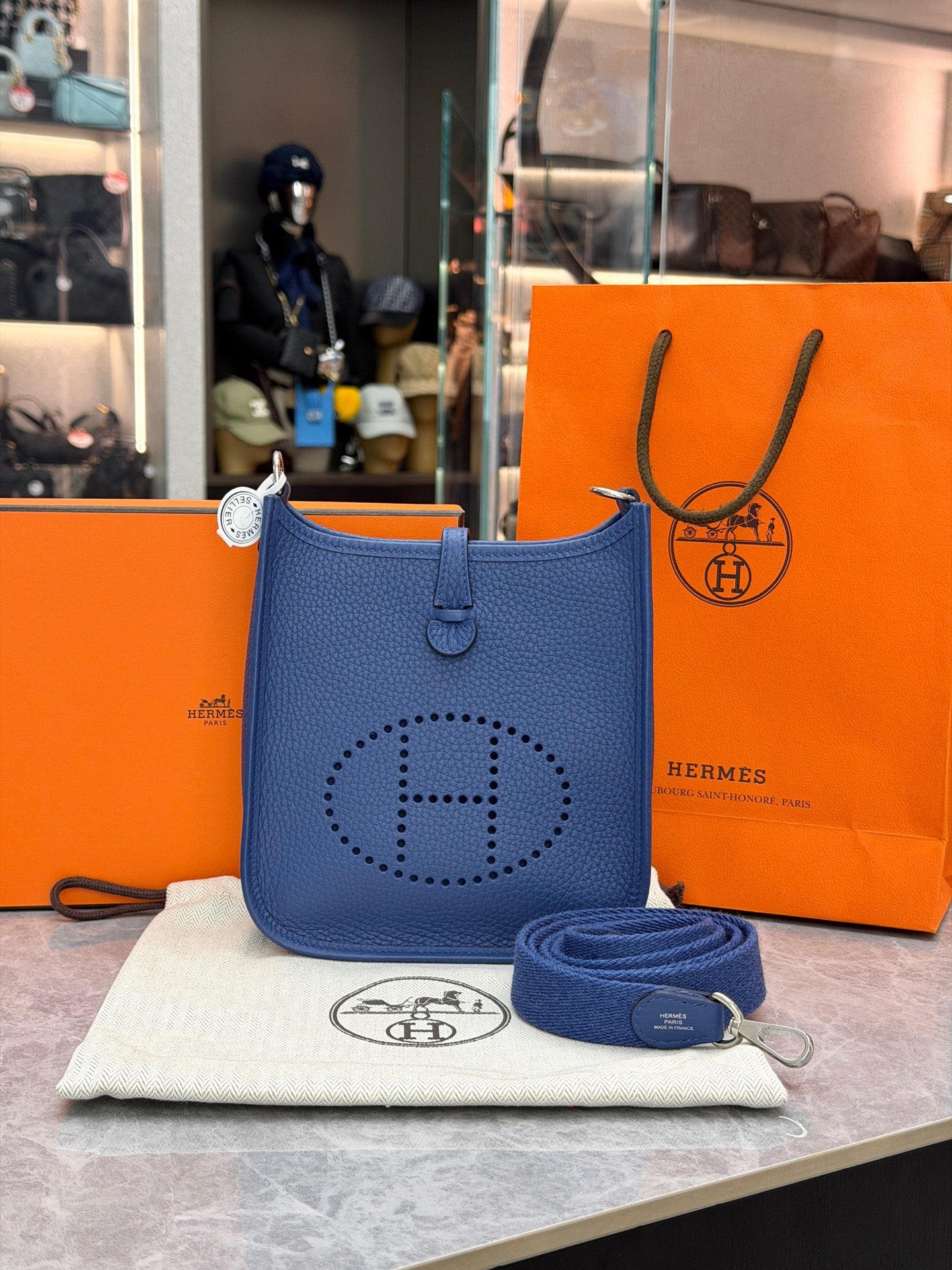This is a Hermès Evelyne 16 Amazone bag in Bleu Tie Clemence leather