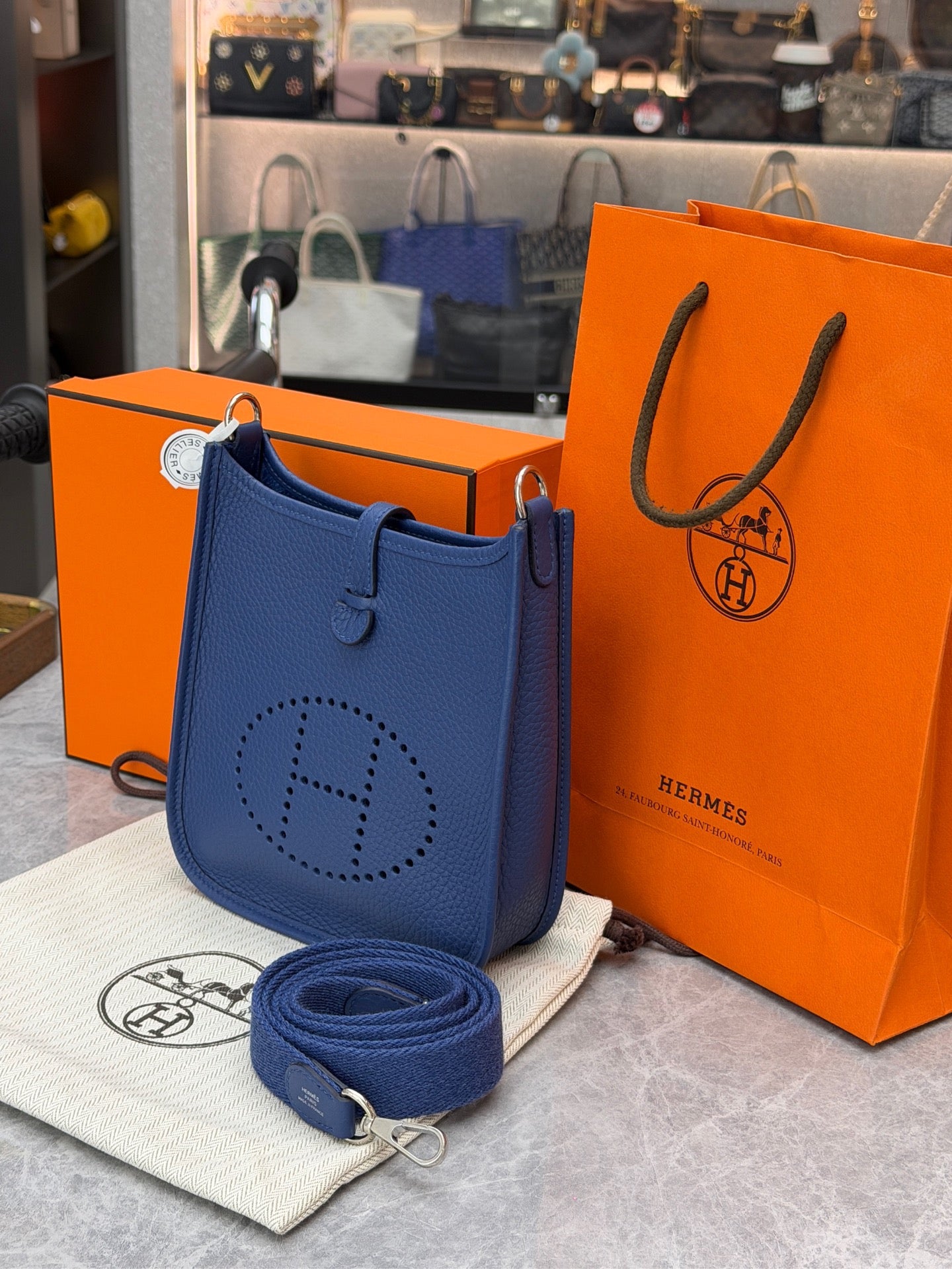 This is a Hermès Evelyne 16 Amazone bag in Bleu Tie Clemence leather