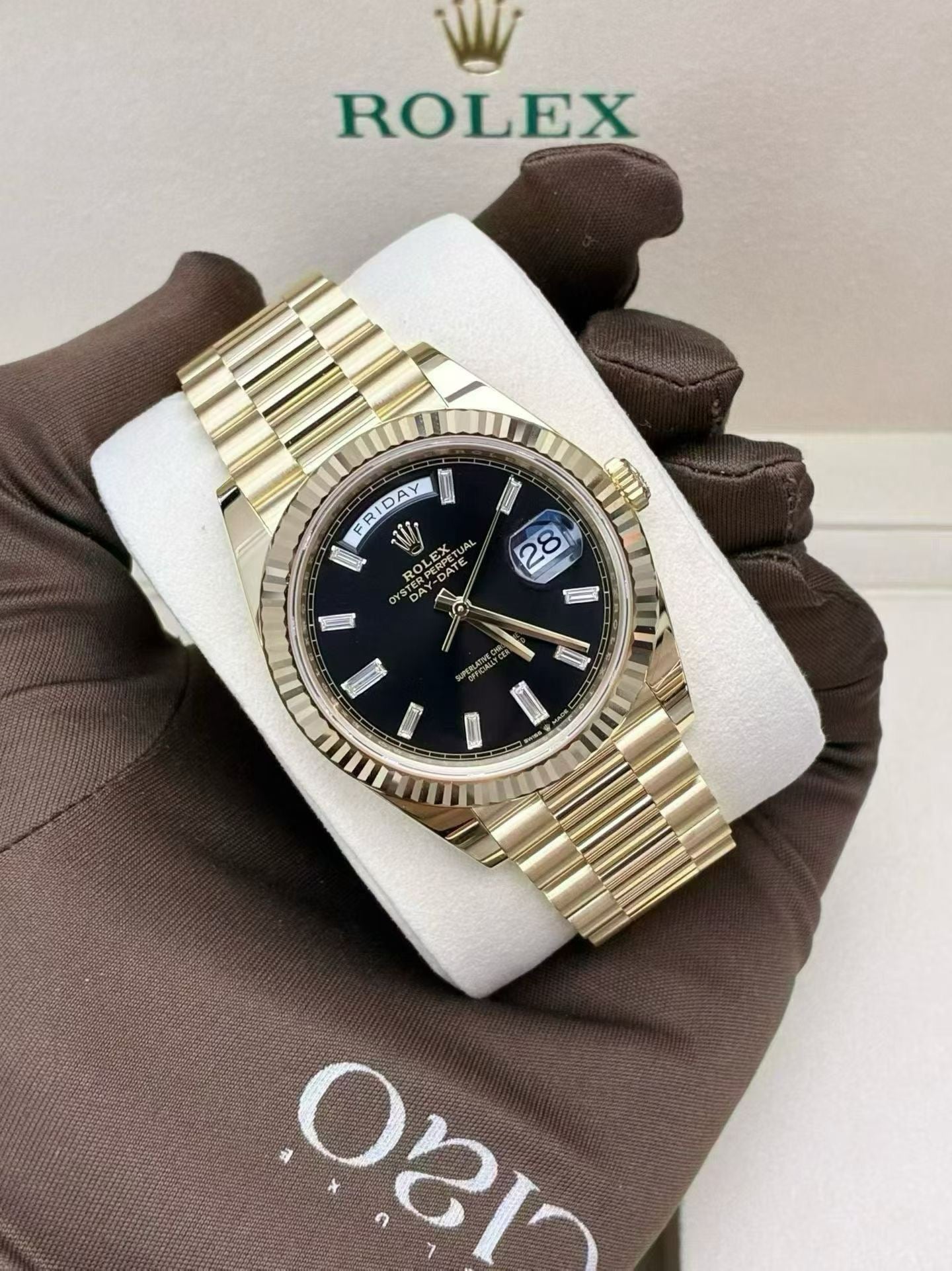 Day-Date 40 Oyster, 40 mm, yellow gold, with a black dial and baguette diamond markers