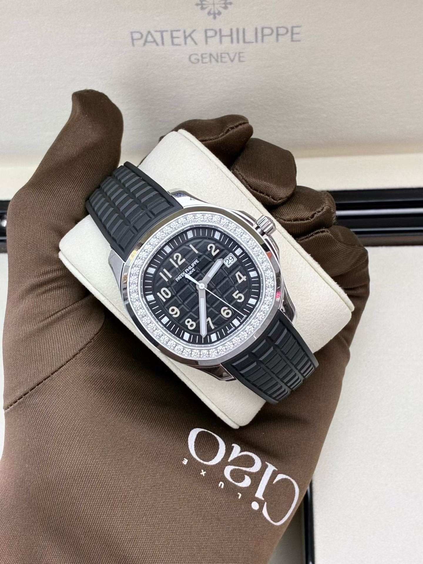 Patek Philippe Aquanaut Luce reference 5267/200A-001 featuring a black dial and diamond-set bezel.