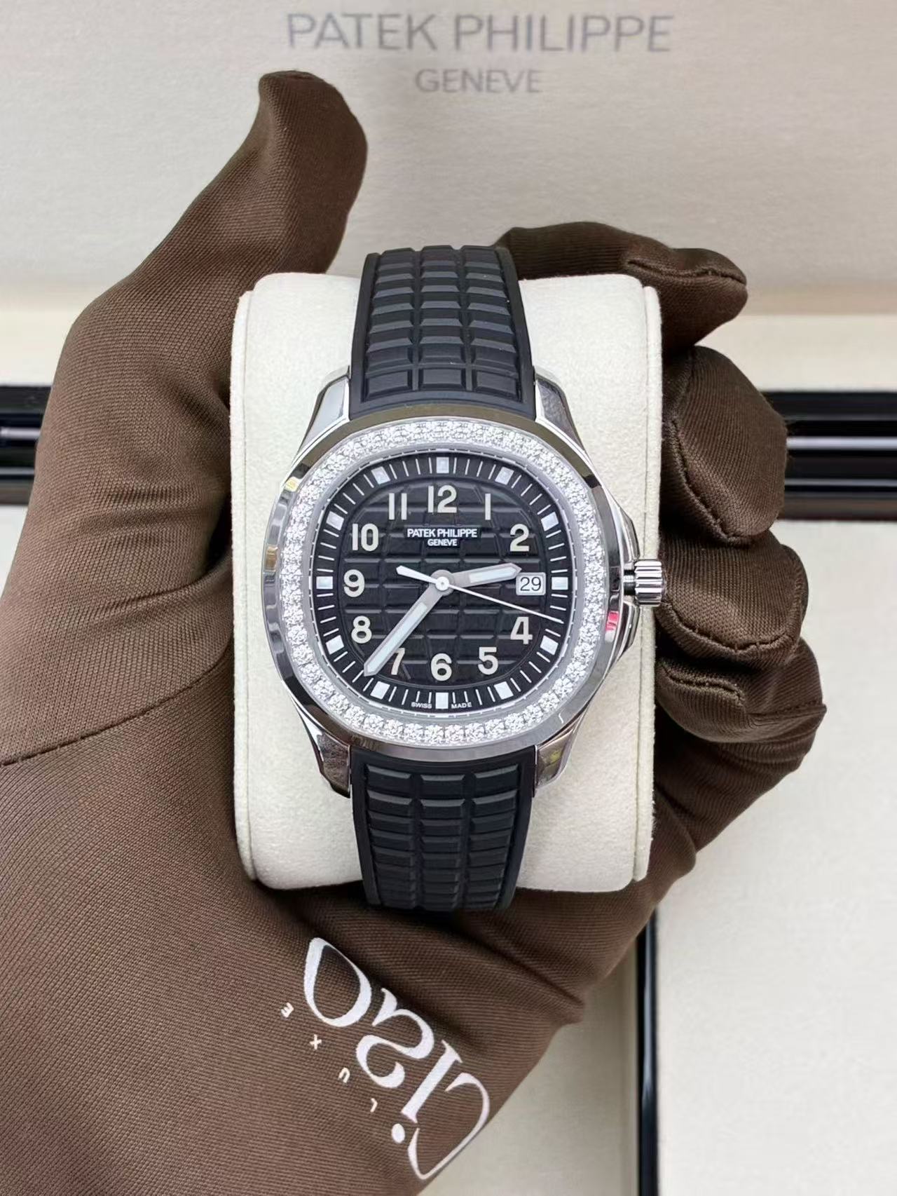 Patek Philippe Aquanaut Luce reference 5267/200A-001 featuring a black dial and diamond-set bezel.