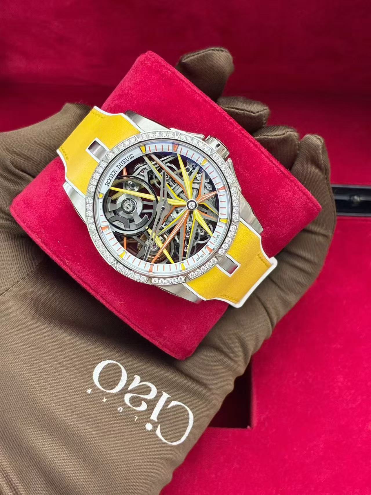 Roger Dubuis Excalibur Monobalancier Blacklight white gold watch featuring a diamond-set bezel and yellow rubber strap