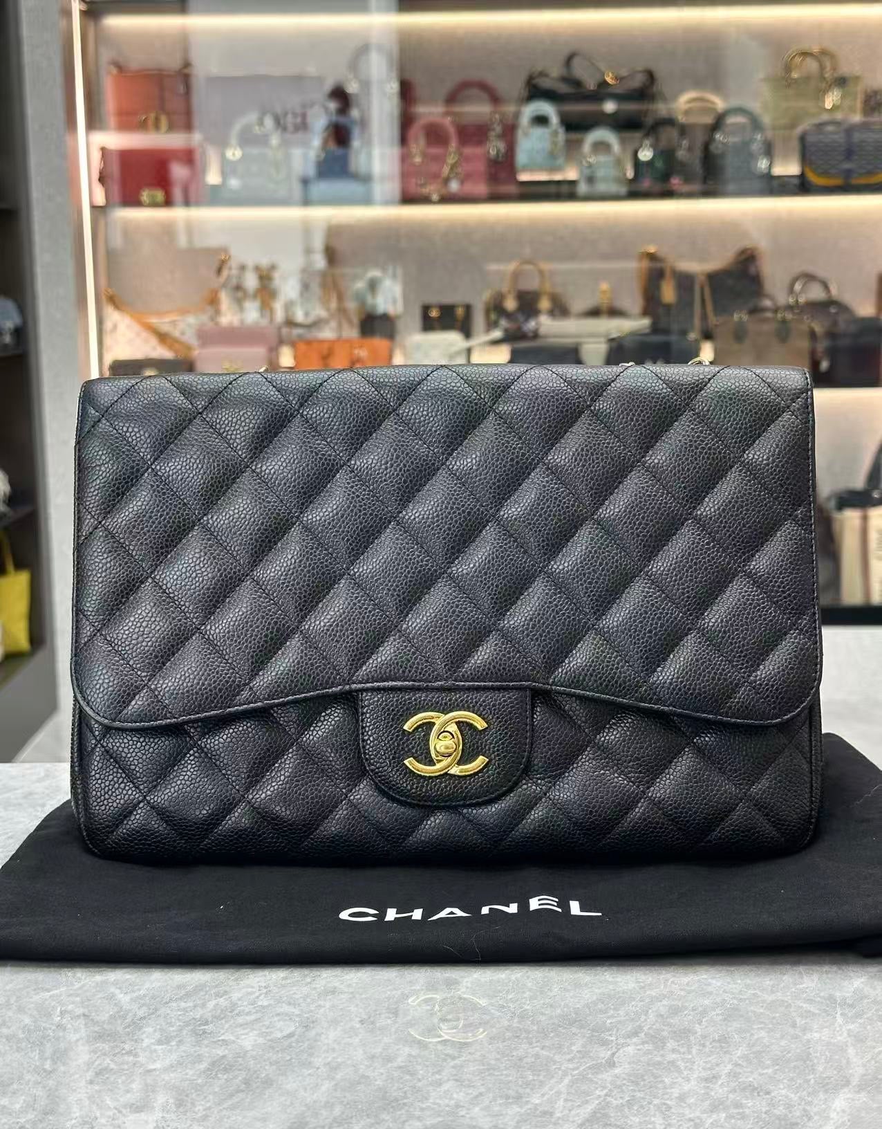 Chanel Classic Single Flap Jumbo Bag in black caviar leather with gold-tone hardware