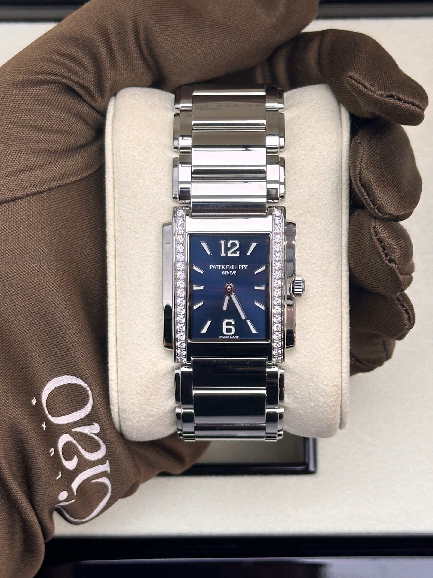 Patek Philippe Twenty~4 Ref. 4910/1200A-001 in stainless steel with a blue sunburst dial and diamond bezel